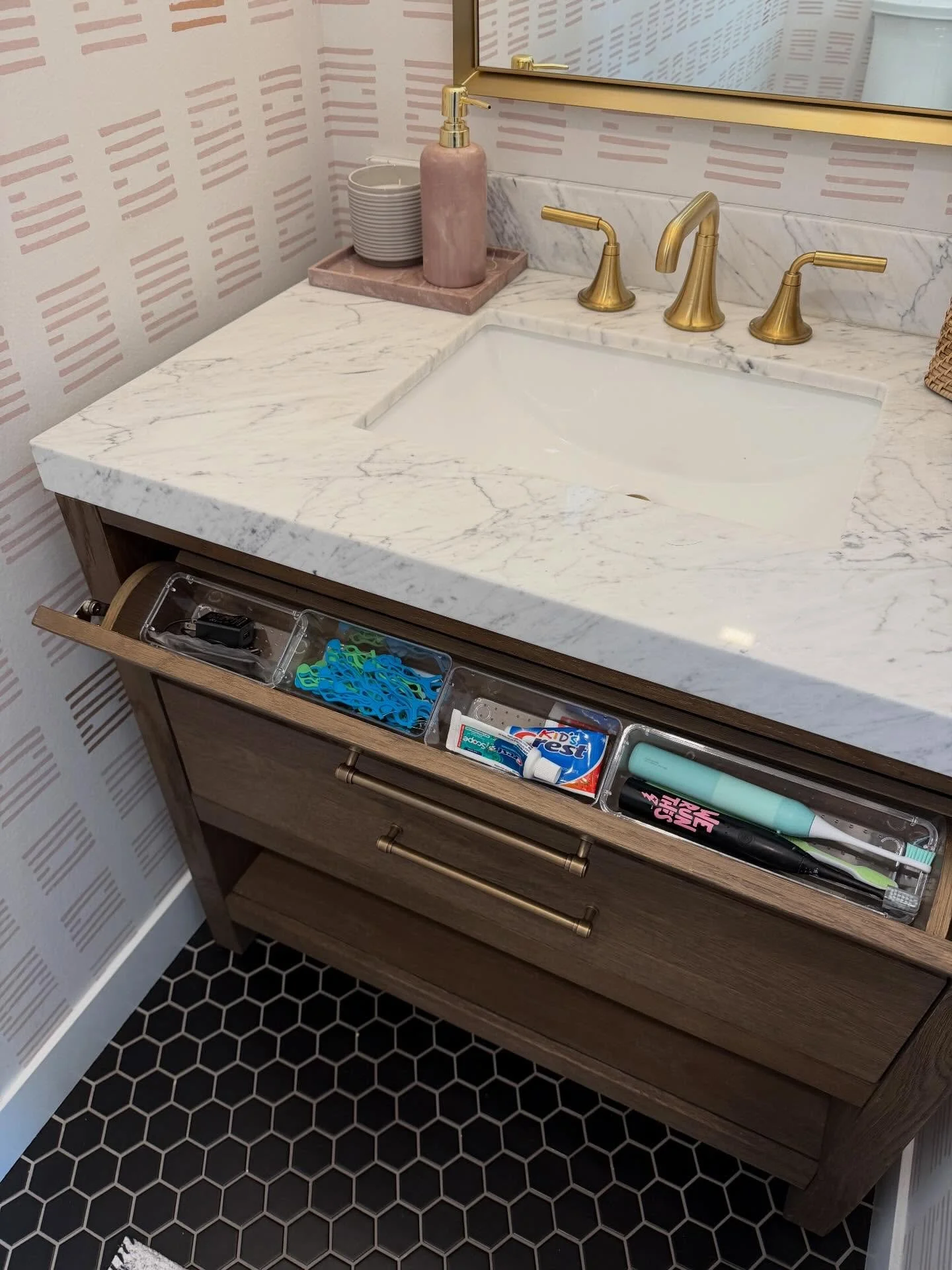 Our morning hack? Keeping it all on the main floor! Hair stuff and toothbrushes live in the bathroom, making it easy for me to style while they eat, and the kiddos can brush those pearly whites right before we're out the door. It's amazing how one si