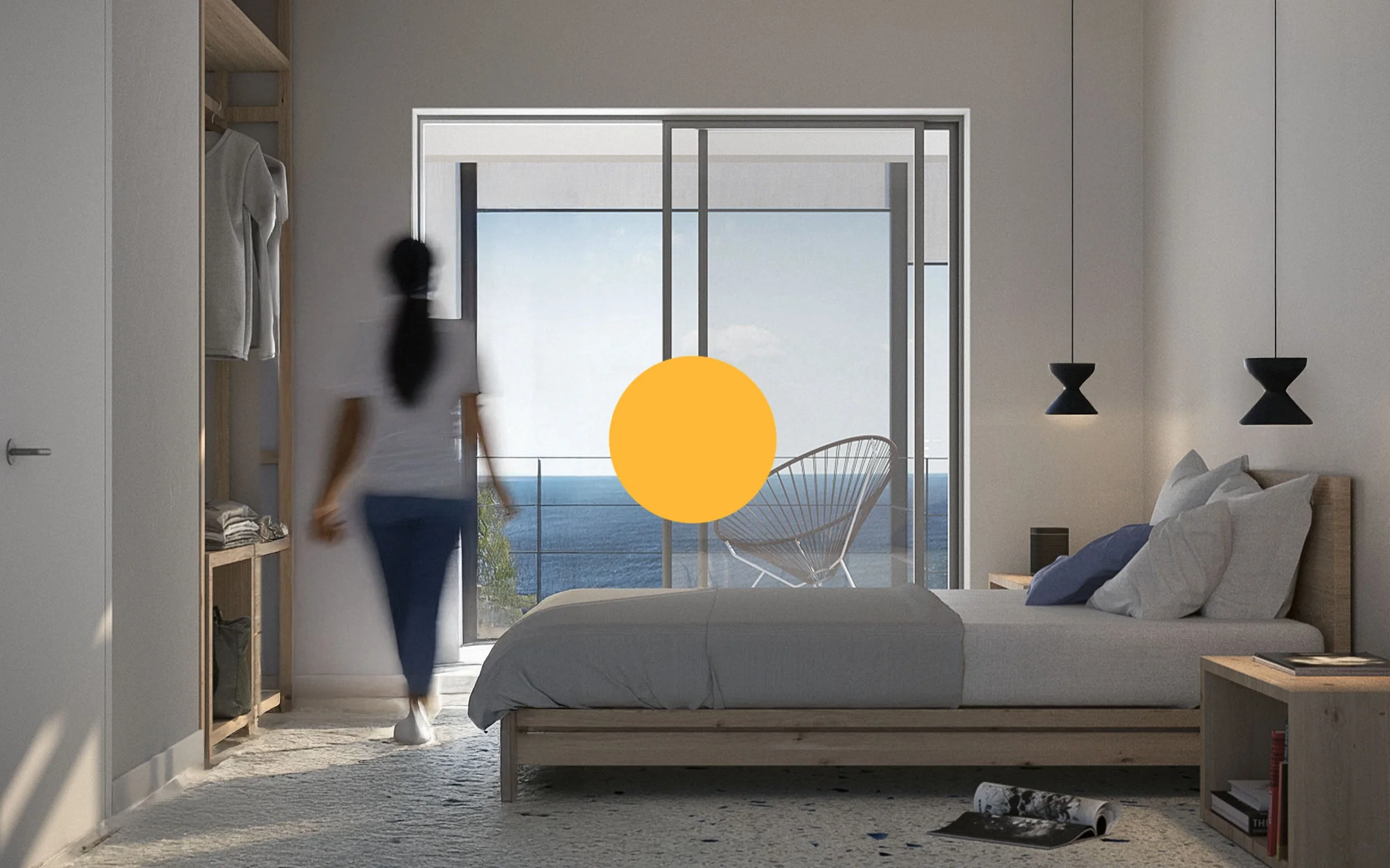 Modern bedroom with sliding glass door leading to balcony and ocean view, bed with white bedding, floating black pendant lights, and a woman walking near open wardrobe.