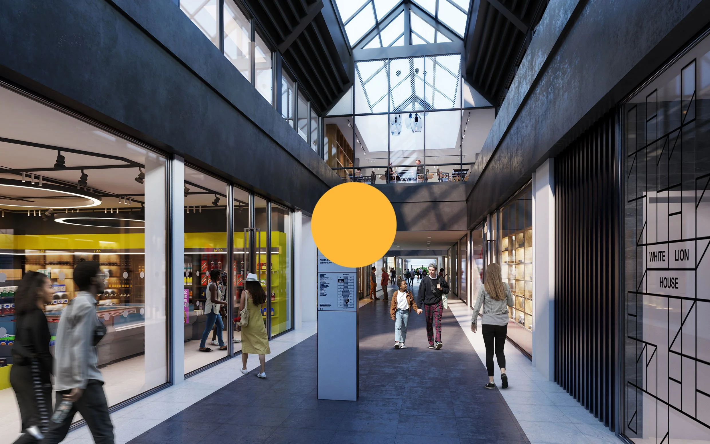 Interior of a modern shopping mall with storefronts, people walking, and a glass ceiling letting in natural light.