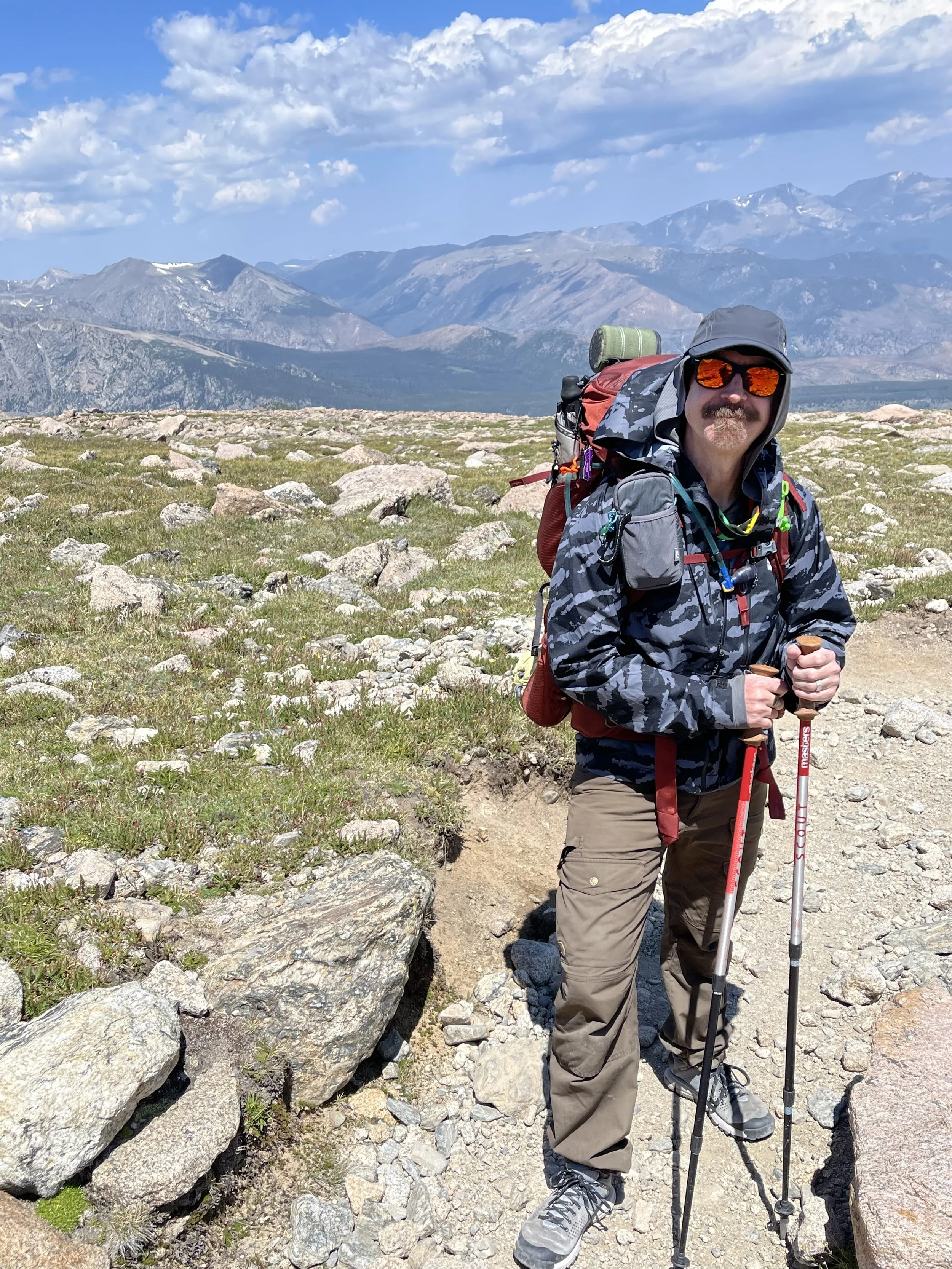 George Sizer Yerger hiking in the mountains.
