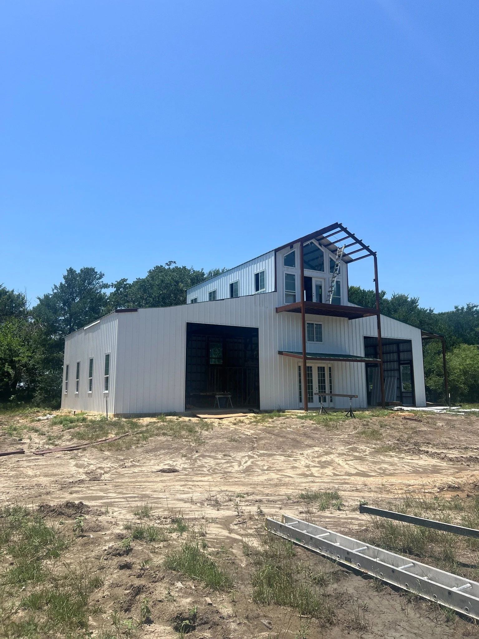 3,000-square-foot two-story steel barndominium built by Medina Valley Welding in Corsicana, Texas