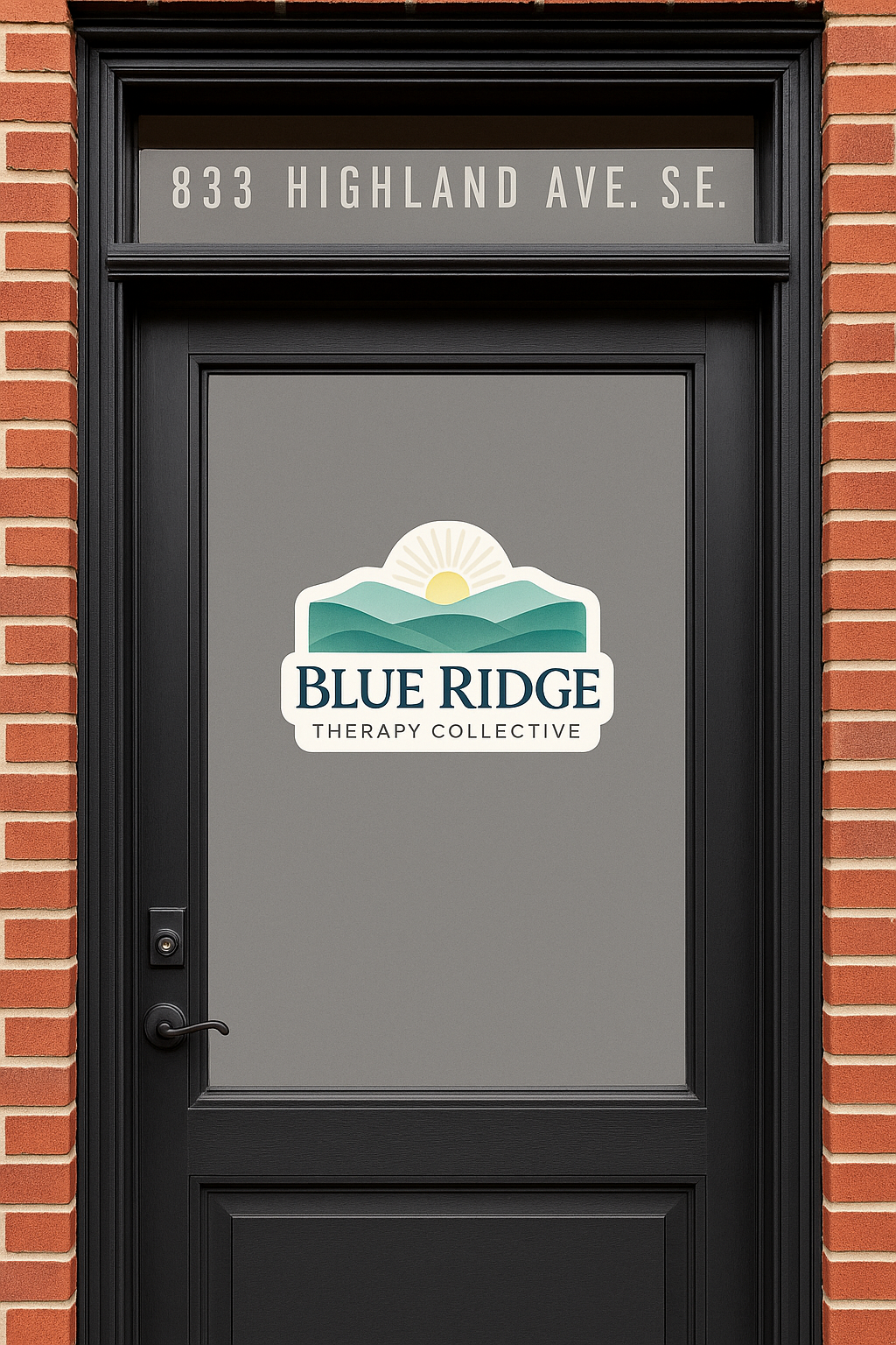 A black door with a sign that reads "Blue Ridge Therapy Collective" and a logo featuring mountains and a rising sun, located at 833 Highland Ave. S.E.