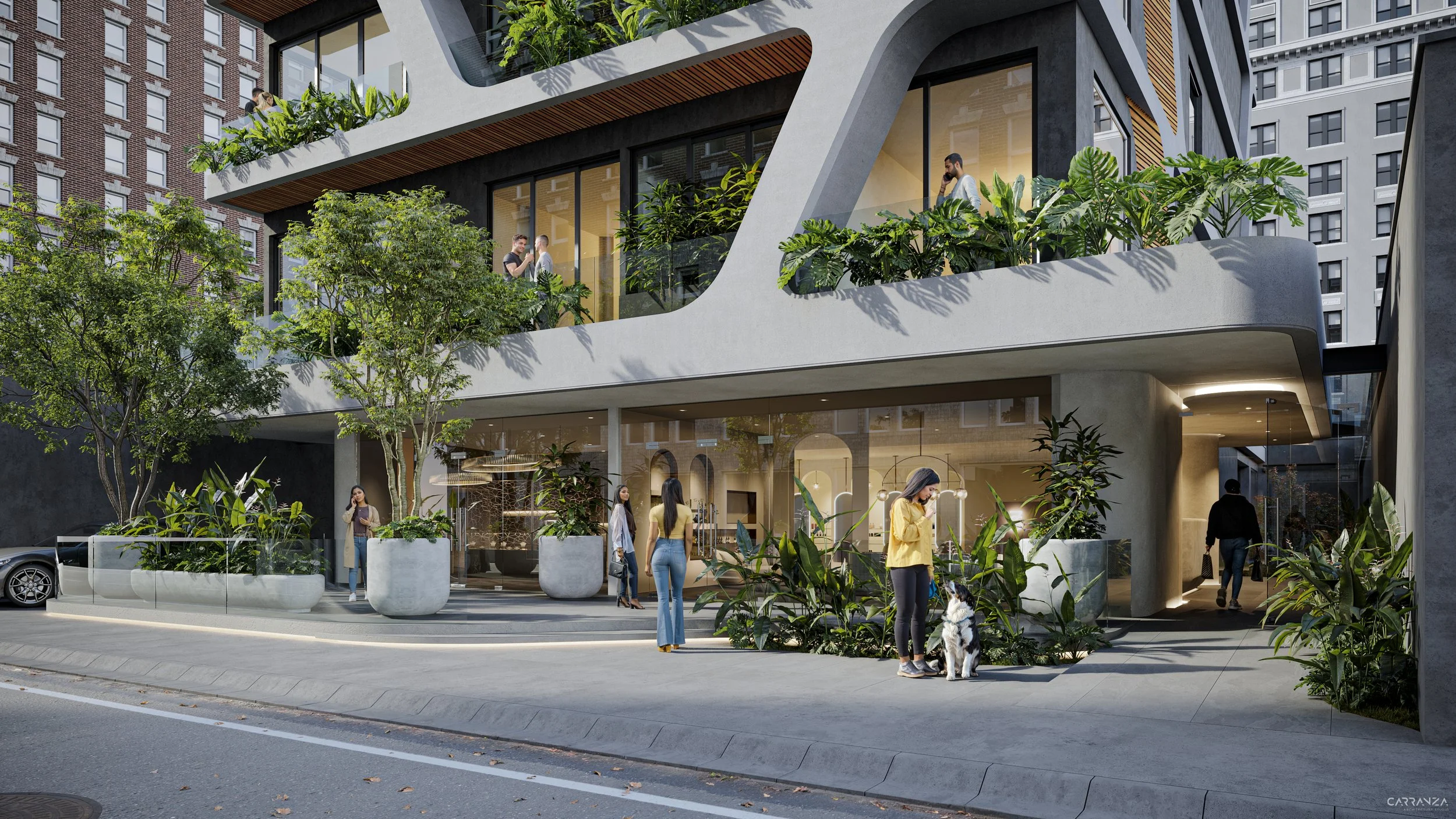 Edificio moderno de varios pisos con fachadas de concreto y grandes ventanas, con áreas verdes en los balcones y en la entrada. Personas caminando y conversando en el exterior, incluyendo una mujer con su perro en la acera.