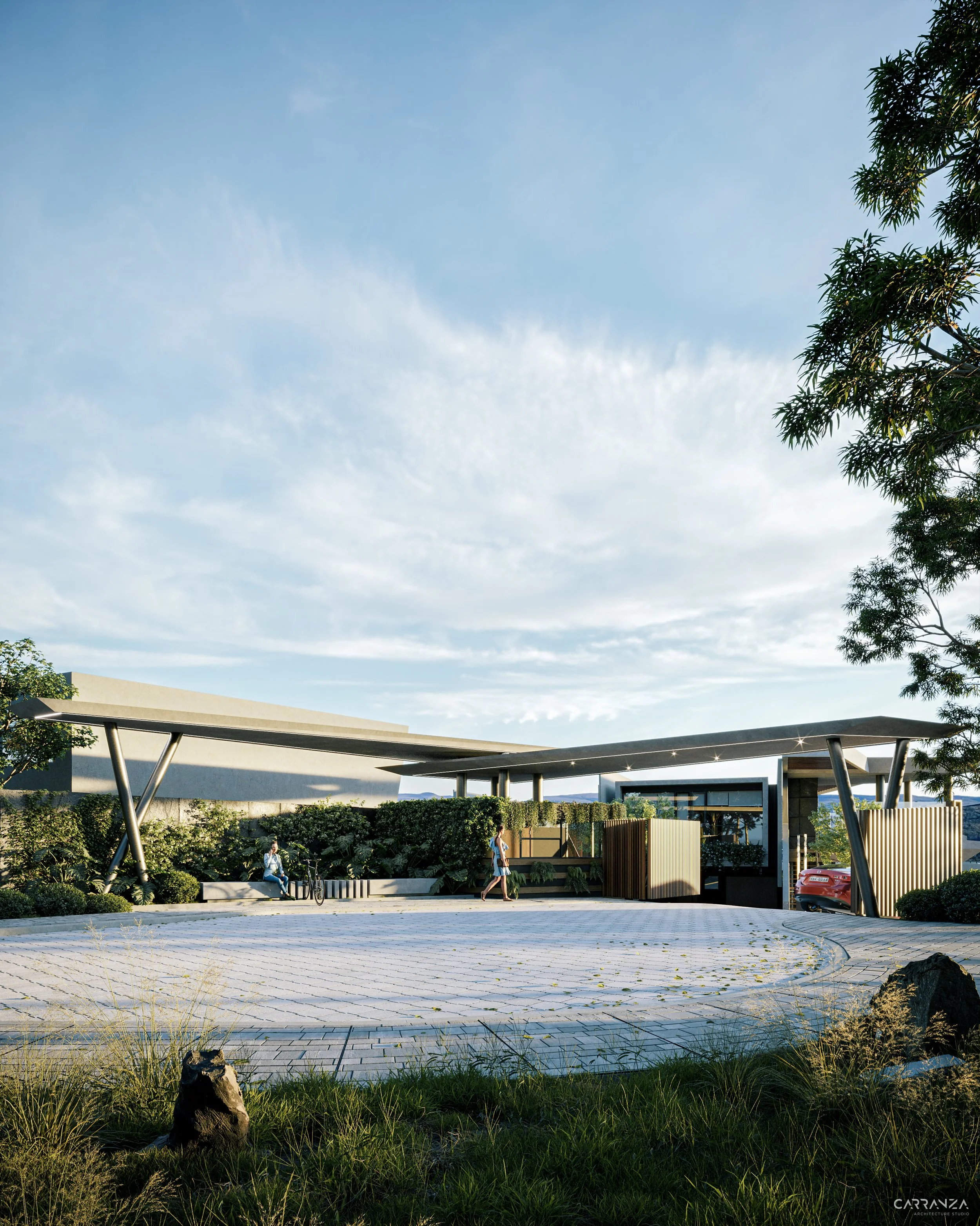 Entrada moderna a una comunidad o parque con estructura de techos en forma inclinada, vegetación y personas caminando, en un día soleado con cielo despejado.