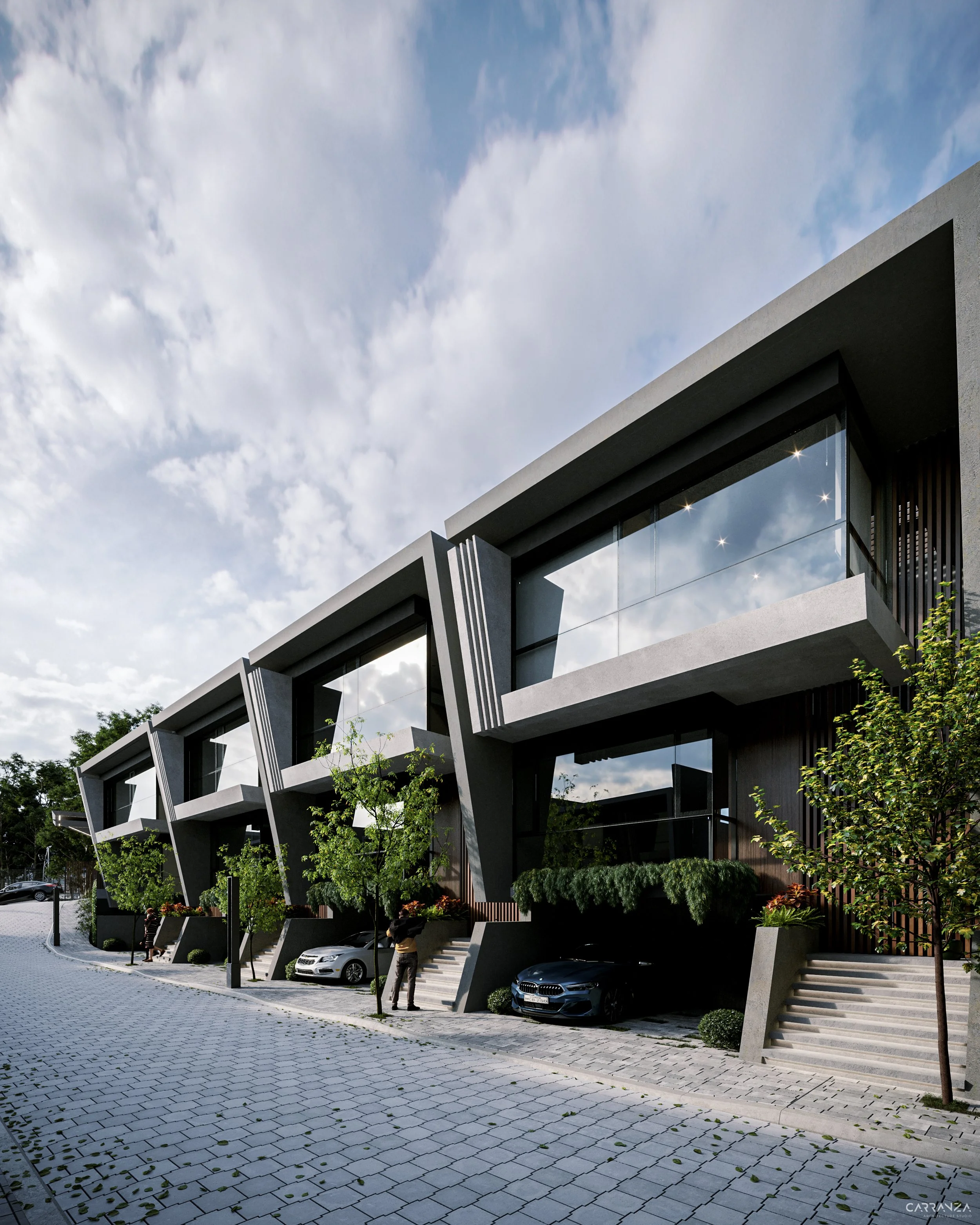 Edificio moderno de varias alturas con grandes ventanas de vidrio y estructura de concreto, rodeado de árboles y coches estacionados, con un cielo nublado en el fondo.