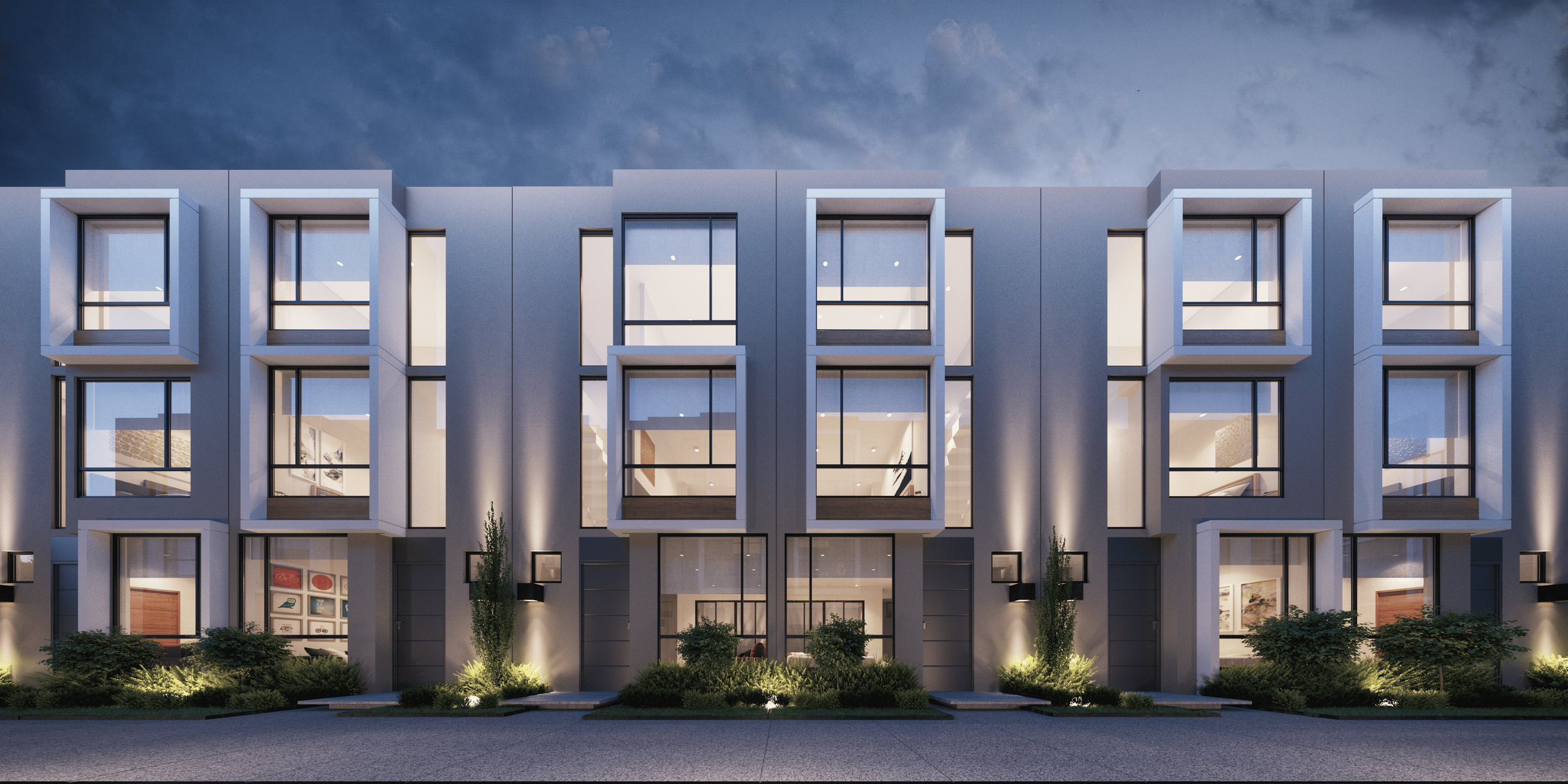 Edificio moderno de varios pisos con ventanas grandes, iluminación exterior y plantas en el jardín, durante la noche.