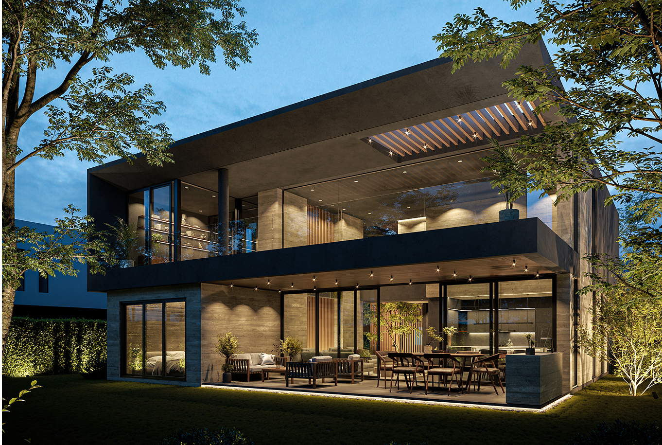 Casa moderna de varios pisos con grandes ventanas y área de descanso al aire libre, iluminada por luces nocturnas, rodeada de árboles y jardín.