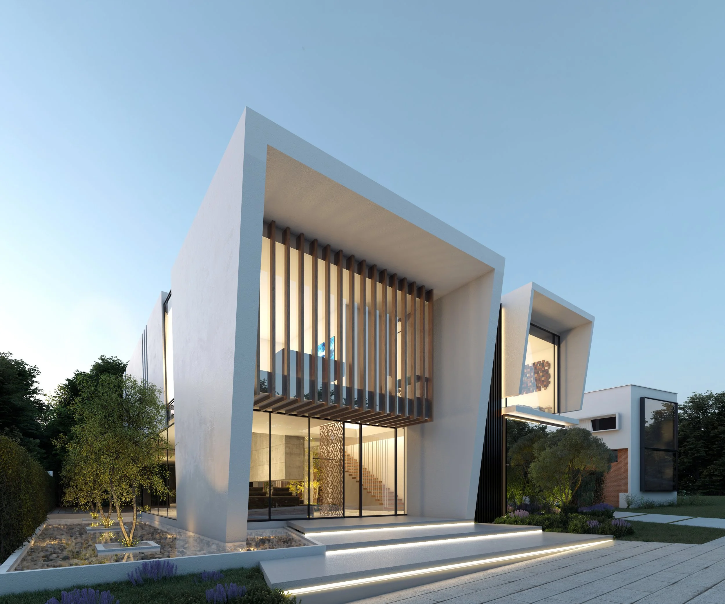 Edificio moderno de arquitectura minimalista con formas angulares y grandes ventanas de vidrio, rodeado de jardines con plantas y árboles, bajo un cielo despejado.