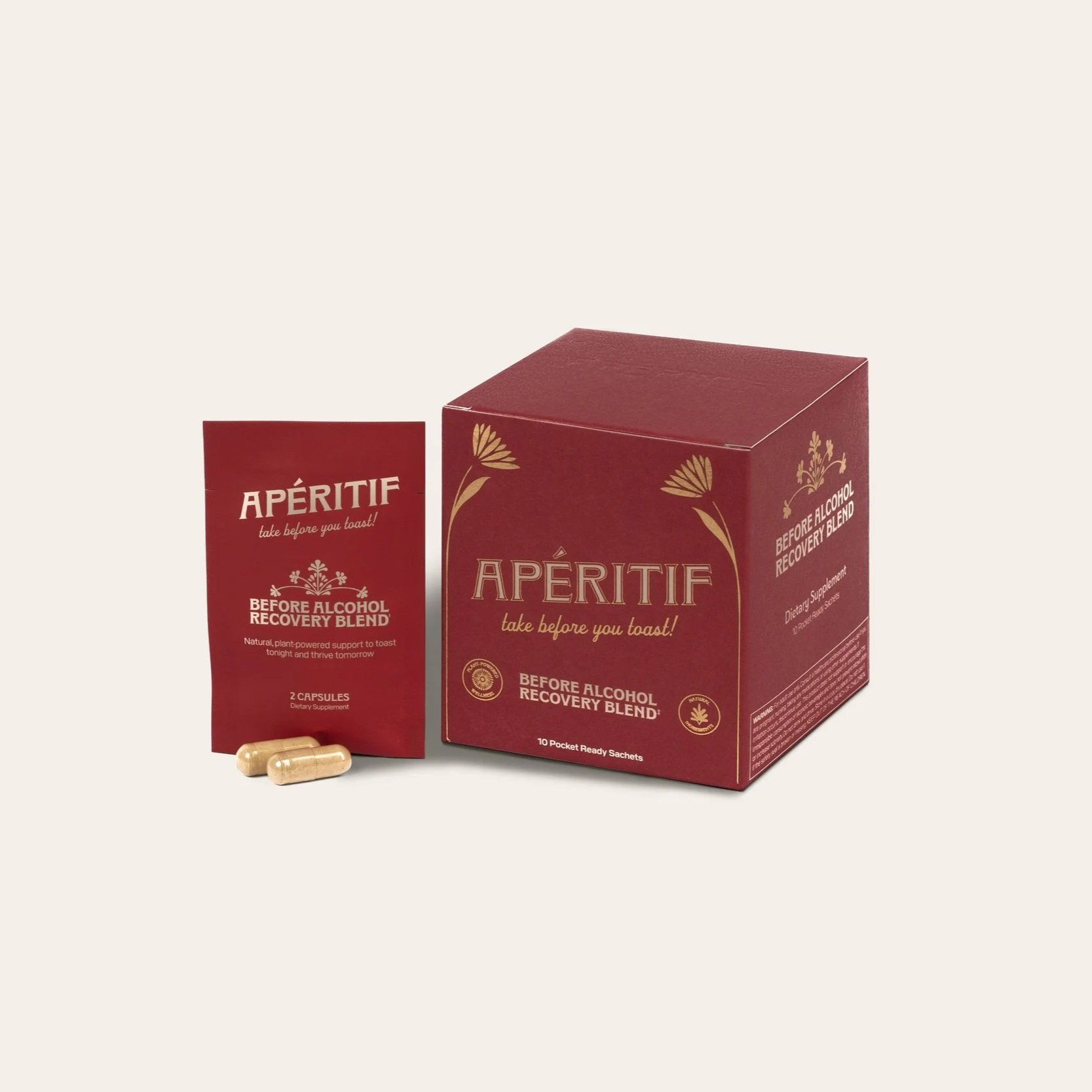 A red box and a red packet labeled 'APÉRITIF' with capsules and herbal symbols, promoting pre-alcohol recovery supplements.