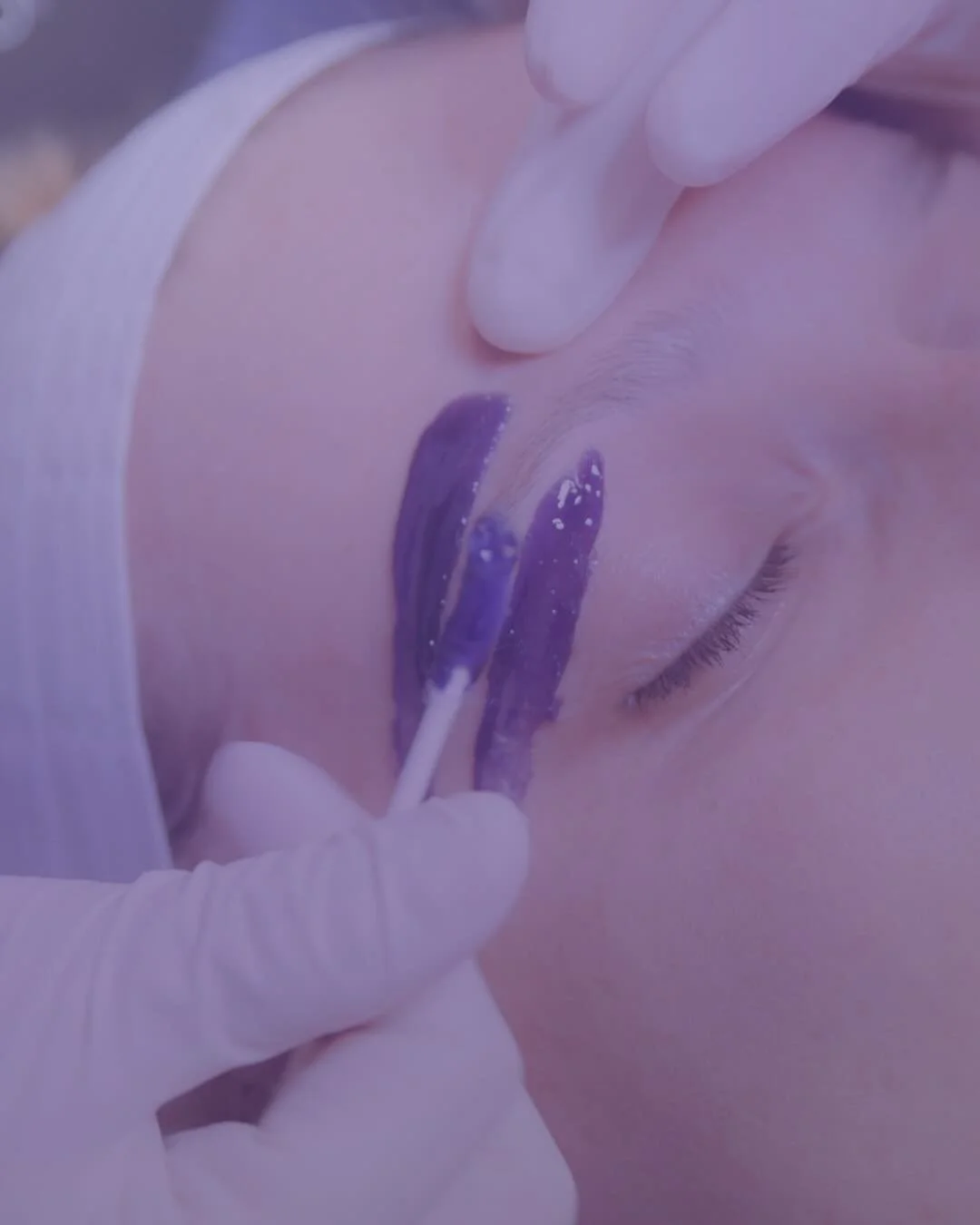 A client receiving a brow wax