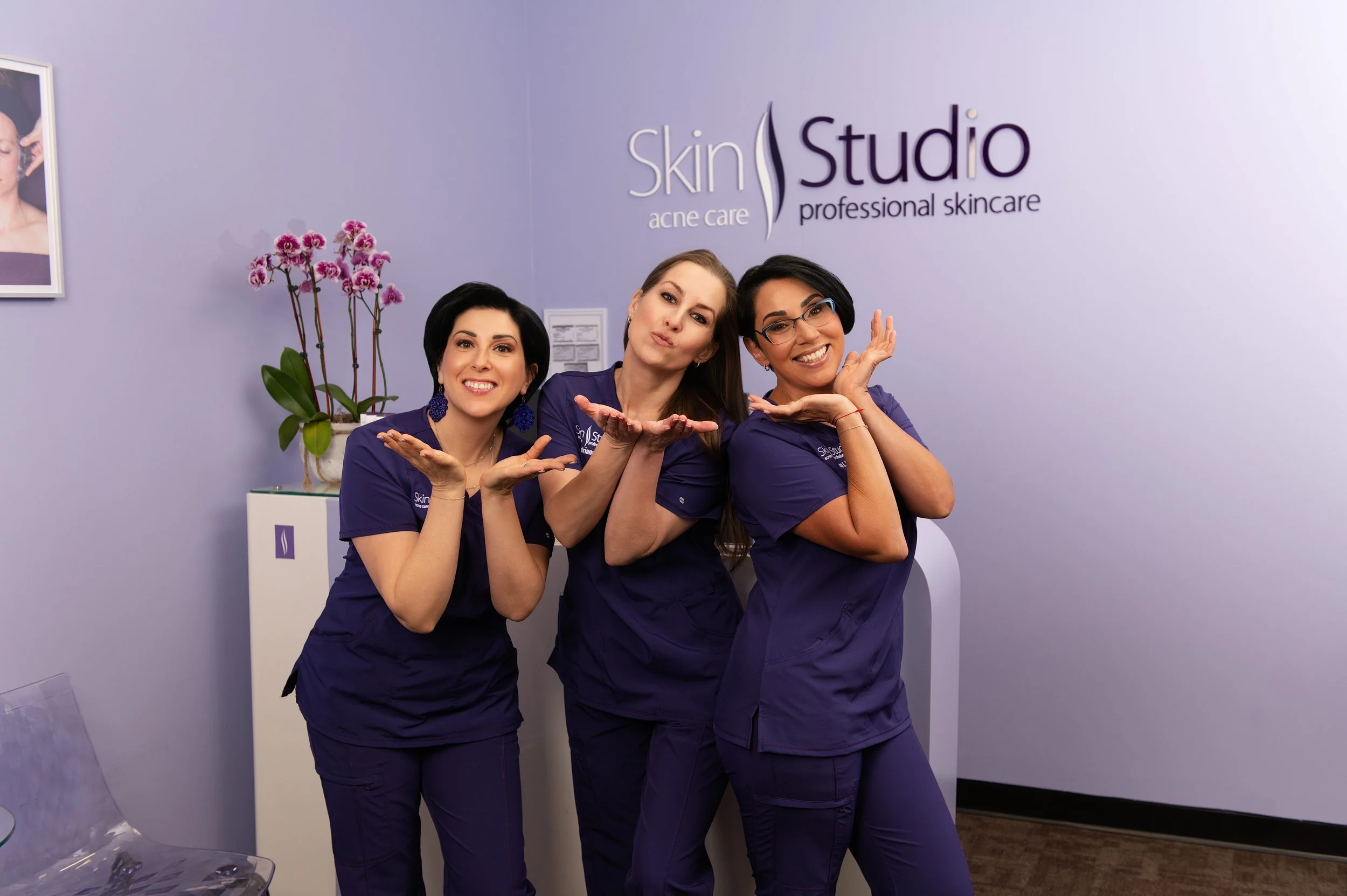 The Skin Studio esthetician team in Natick, MA blowing a kiss..