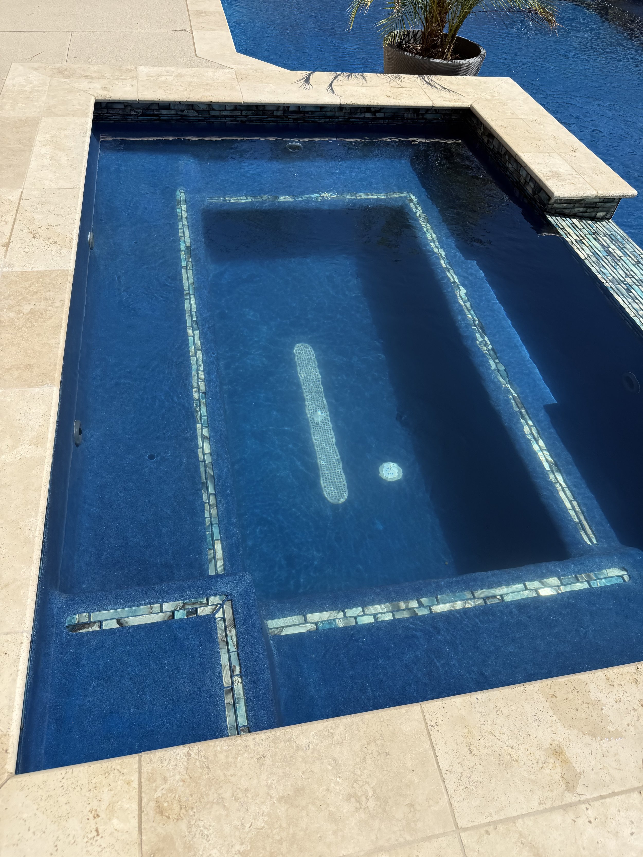 Spa with detailed tile finish and crystal-clear water in Midland, TX.