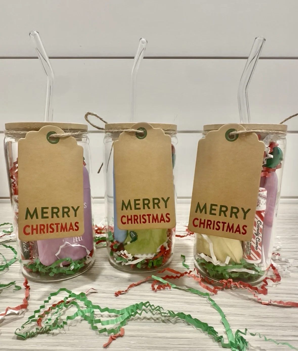 Glass tumbler with small gifts and money for gifting