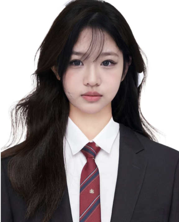 A young woman with long dark hair wearing a black blazer, white shirt, and red striped tie, posing against a plain white background.