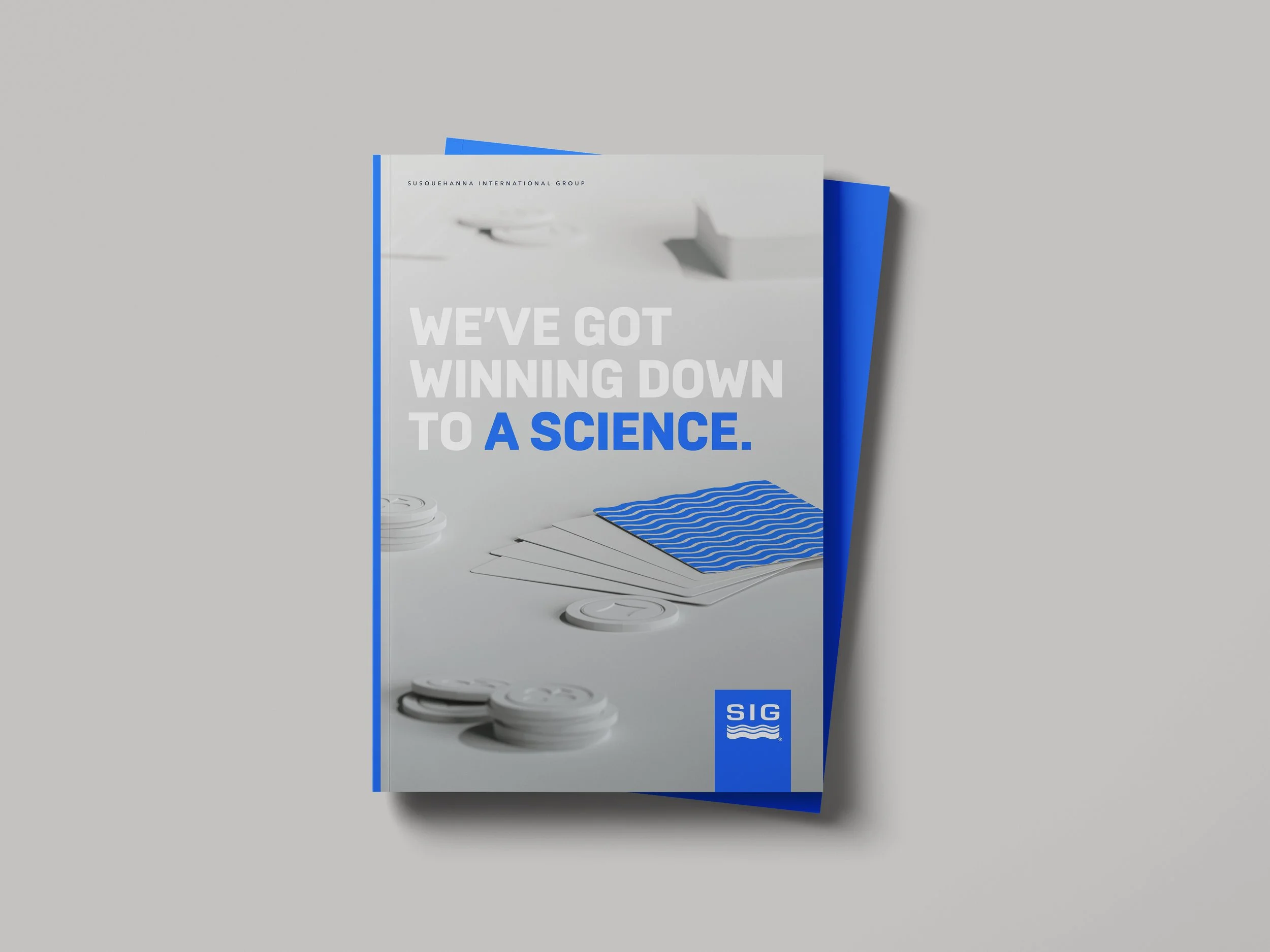 Brochure with the text 'We've got winning down to a science' featuring blue and white design elements, including paper samples, buttons, and wavy patterns.