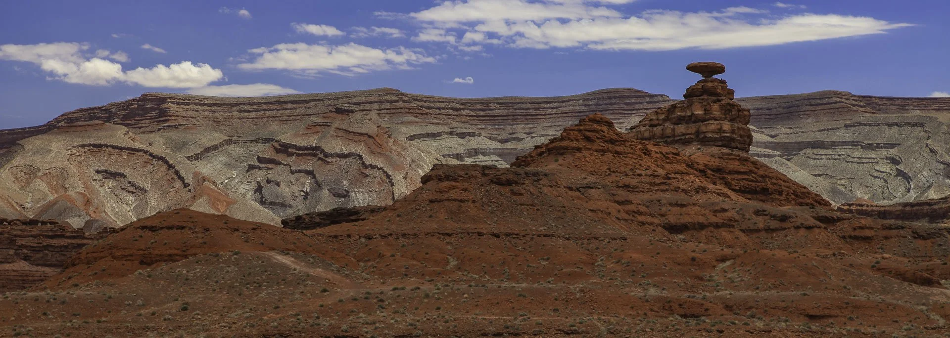 Mexican Hat rock formation near Monument Valley rising above the desert landscape