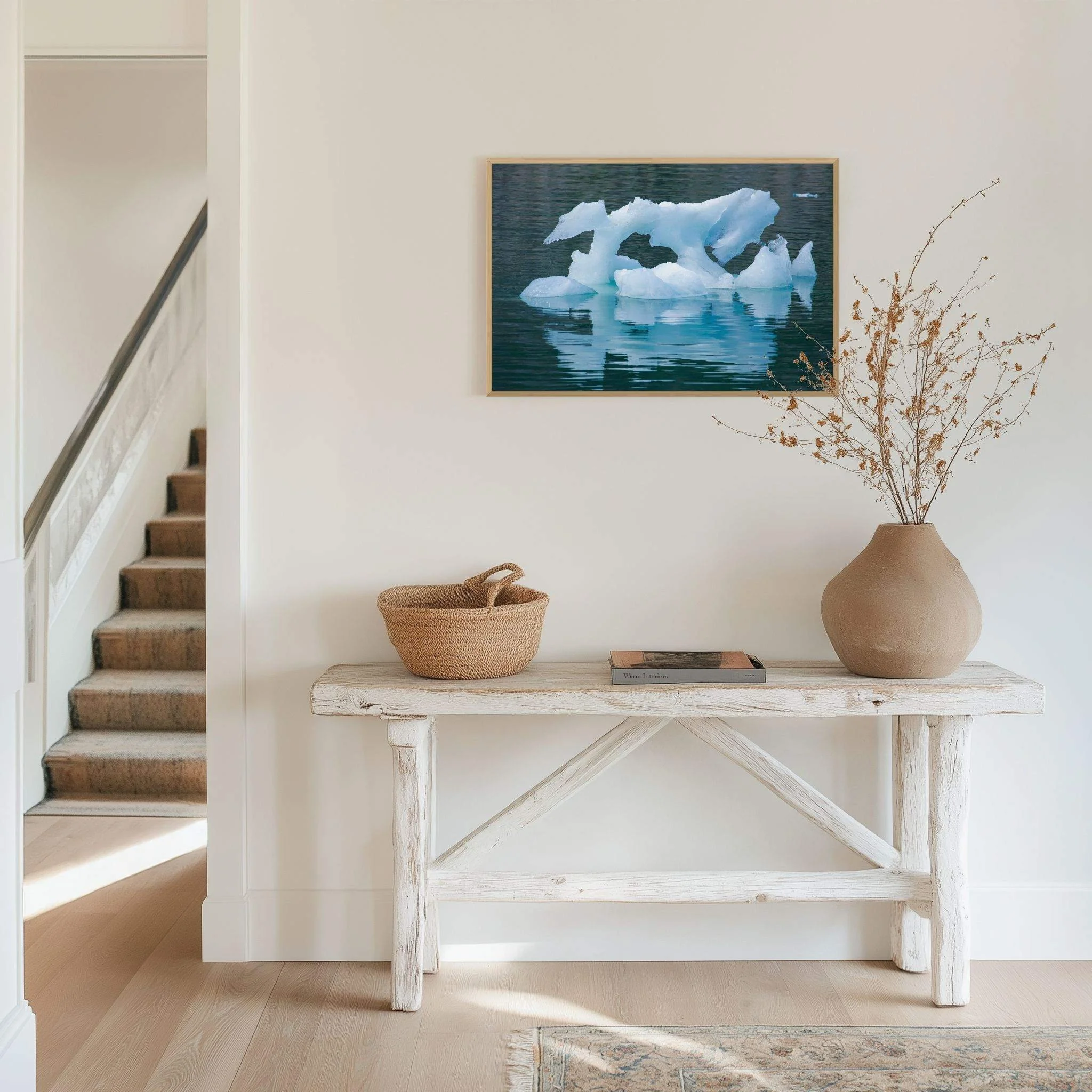 Ice Sculpture Fine Art photograph depicting a sculptural blue iceberg floating on calm water, Alaska, displayed in an entryway, mounted on Dibond in a Natural Oak wood frame.