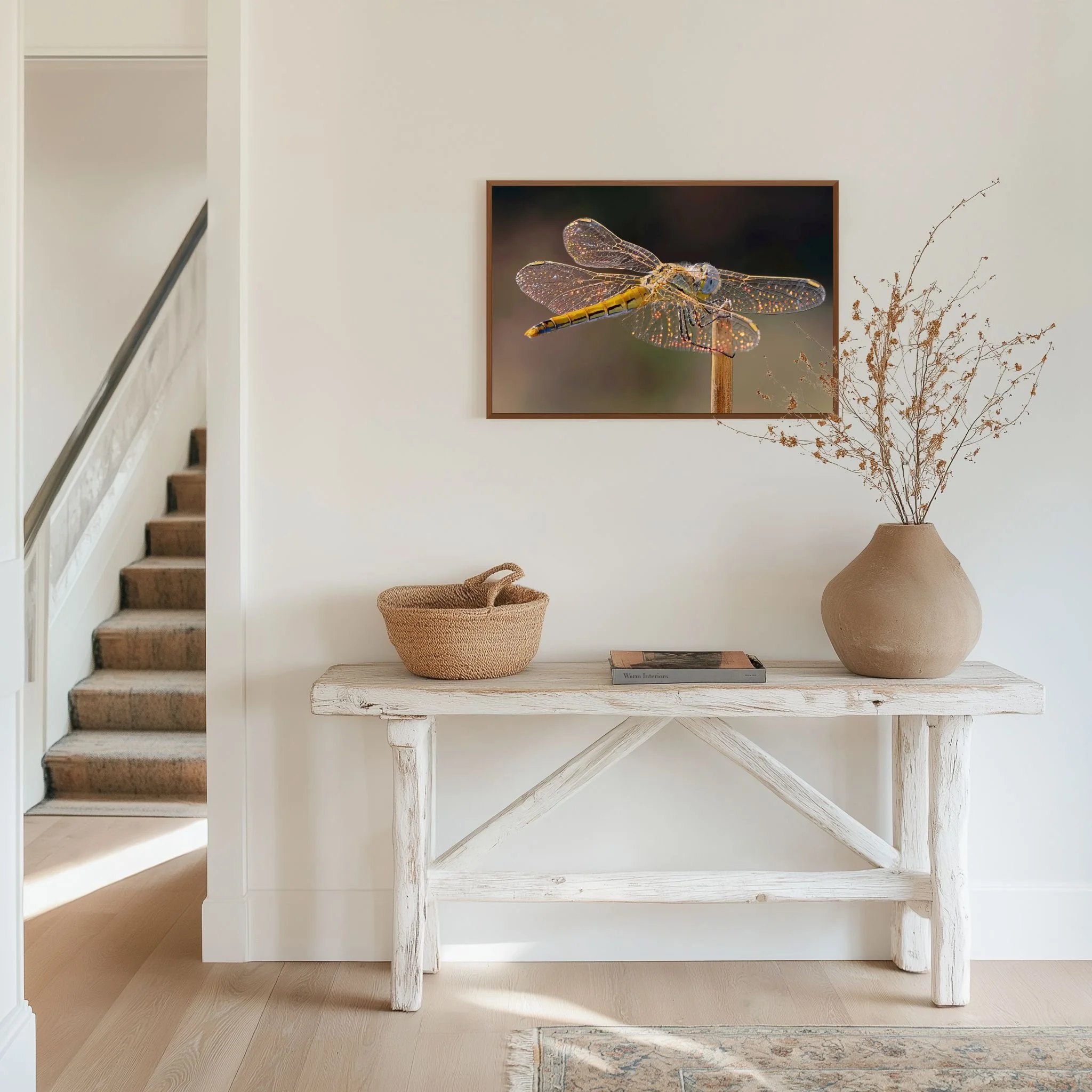 Stained Glass dragonfly Fine Art photograph displayed above a rustic white console in a bright, neutral interior.