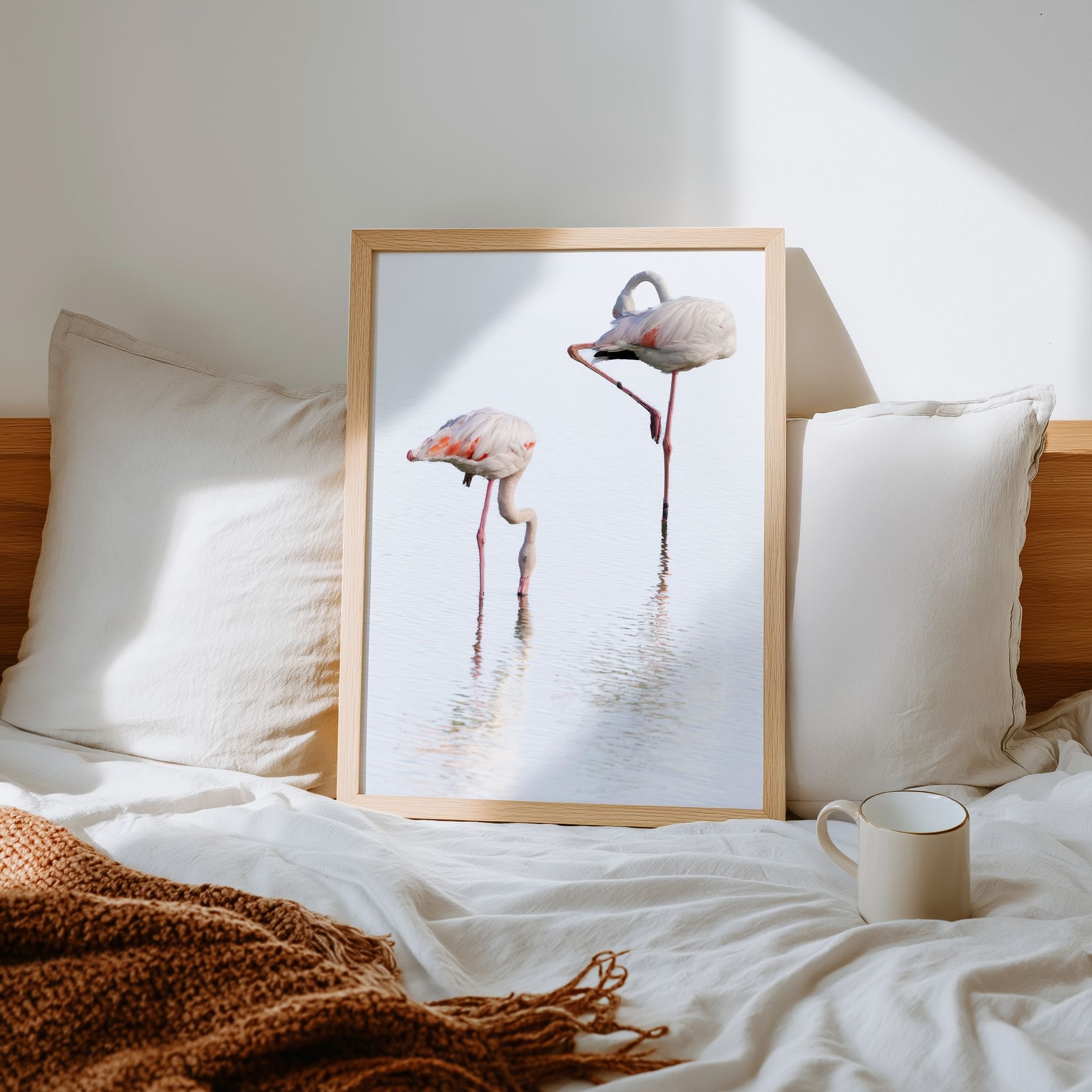 Together limited edition wildlife photograph in a natural oak frame, displayed in a softly lit bedroom.