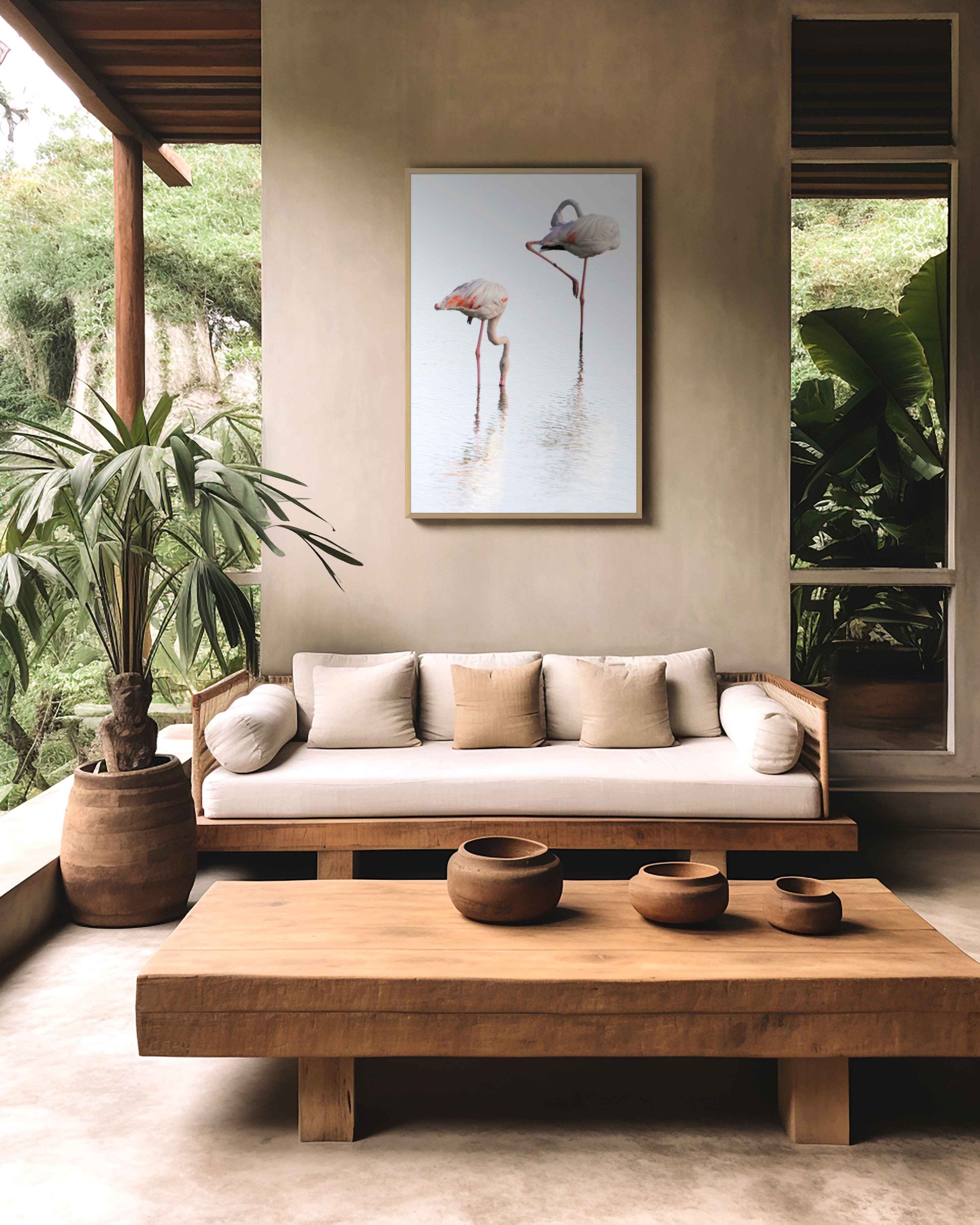 Together limited edition wildlife photograph in a natural oak frame, displayed in a warm interior surrounded by tropical vegetation.