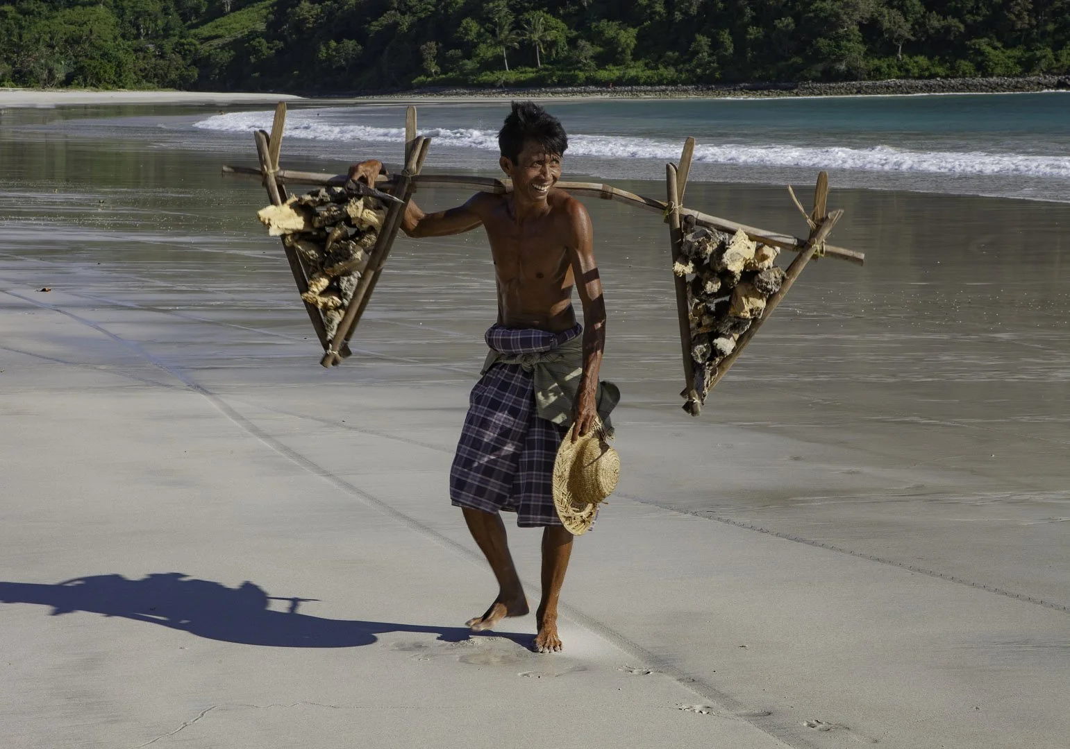 josephbphotography-travels-indonesia-lombok-wood-carrier-on-the-beach.jpg