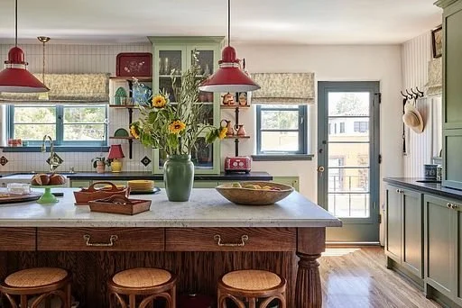 Spanish Colonial Revival kitchen in Pasadena Los Angeles with Farrow & Ball Breakfast Room Green cabinets, marble island, and open shelving Caption: Pasadena Spanish. Two walls came out; every original wood window stayed.