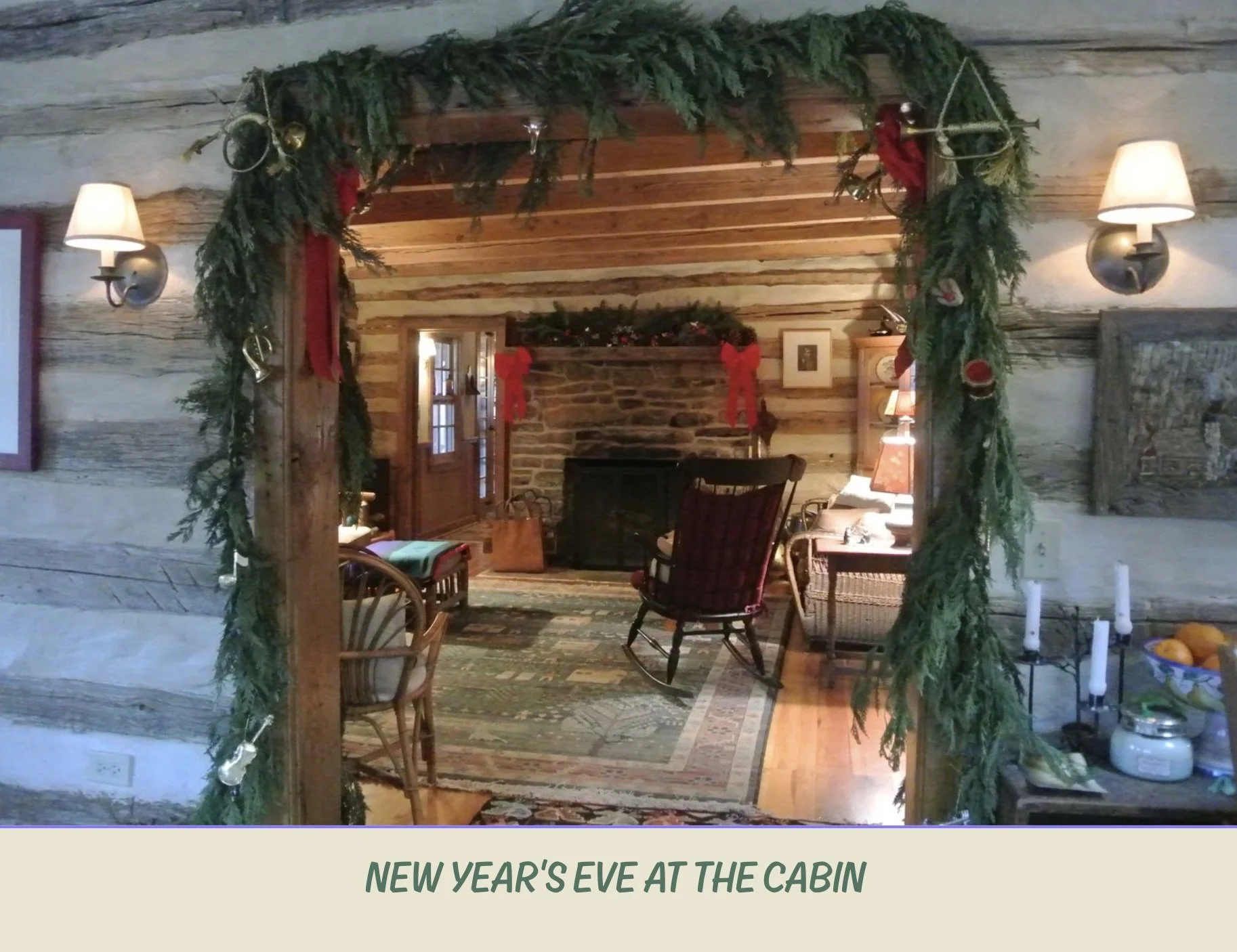 A cozy cabin interior decorated for Christmas with a garland framing the entryway, a brick fireplace, and wooden furnishings.