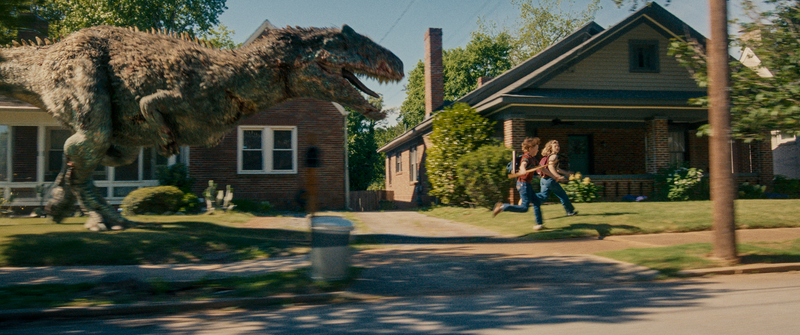 In David Robert Mitchell's 2026 film THE END OF OAK STREET, Brian (Christian Convery) and Audrey Platt (Maisy Stella) run from a dinosaur down a picturesque 1982 suburban street.