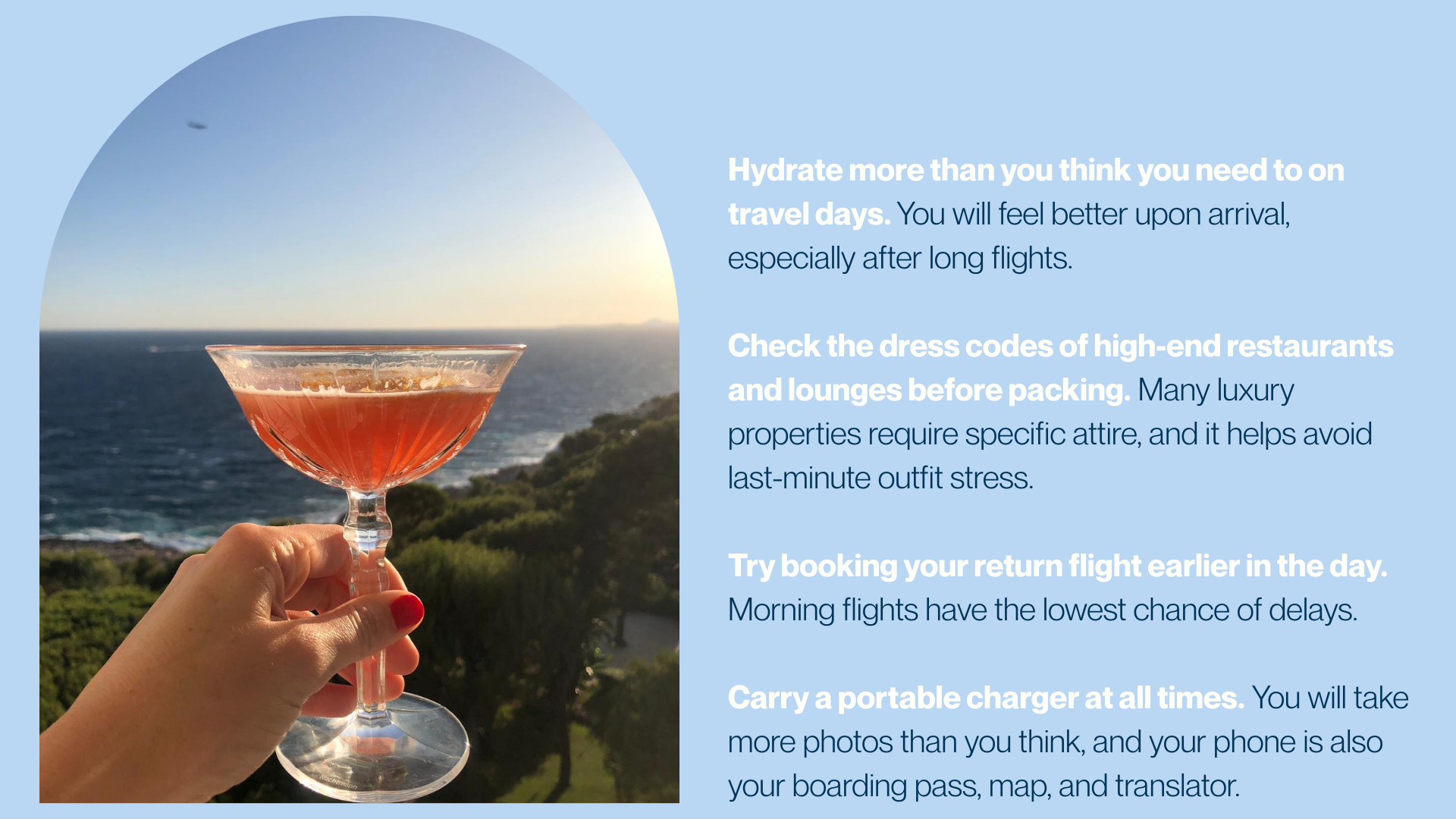A hand holding a cocktail glass with a pink beverage against a seaside landscape with a helicopter flying in the sky.