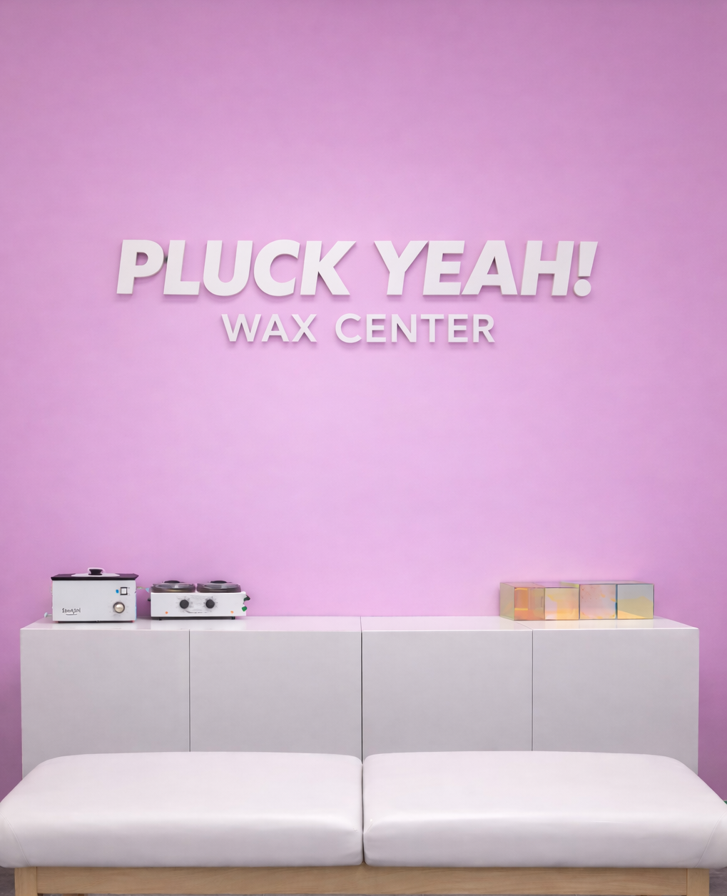 Pink waxing studio interior at Pluck Yeah Wax Center in Roseville California