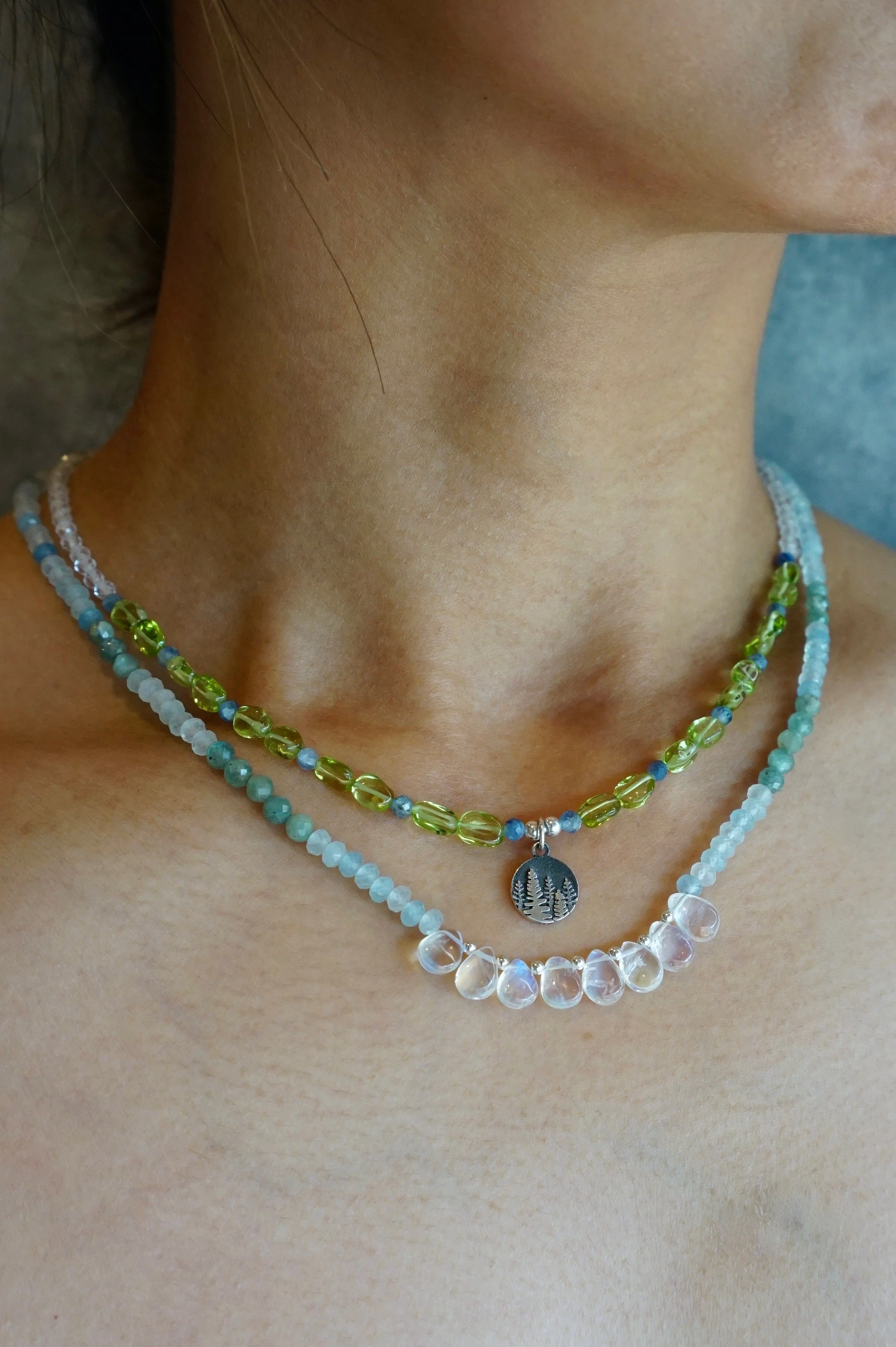 Jeweliana Studio Lake Tahoe Thailand hand-made pine tree silver pendent peridot nuggets blue kyanite beads and rock crystals layered with rainbow moonstone necklace