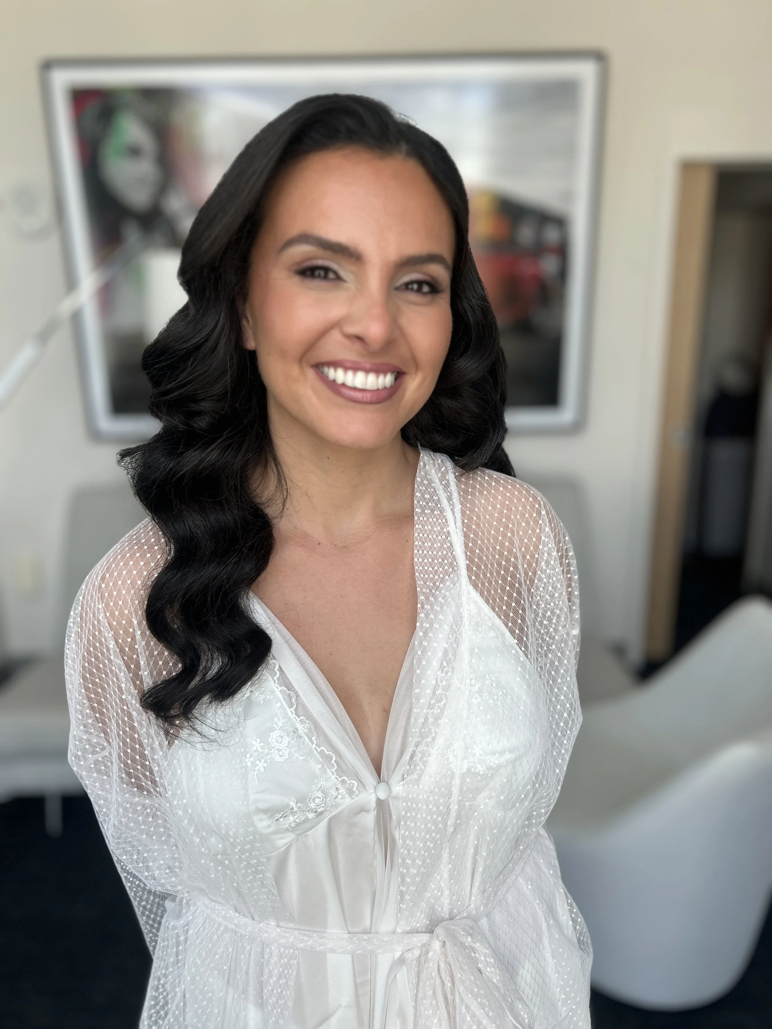 Luxury bridal hairstyle with dark hair Hollywood glam waves for a Florida wedding by Tampa bridal hairstylist Lori Brooks Beauty. Elegant, long-lasting wedding hair designed to withstand heat and humidity.