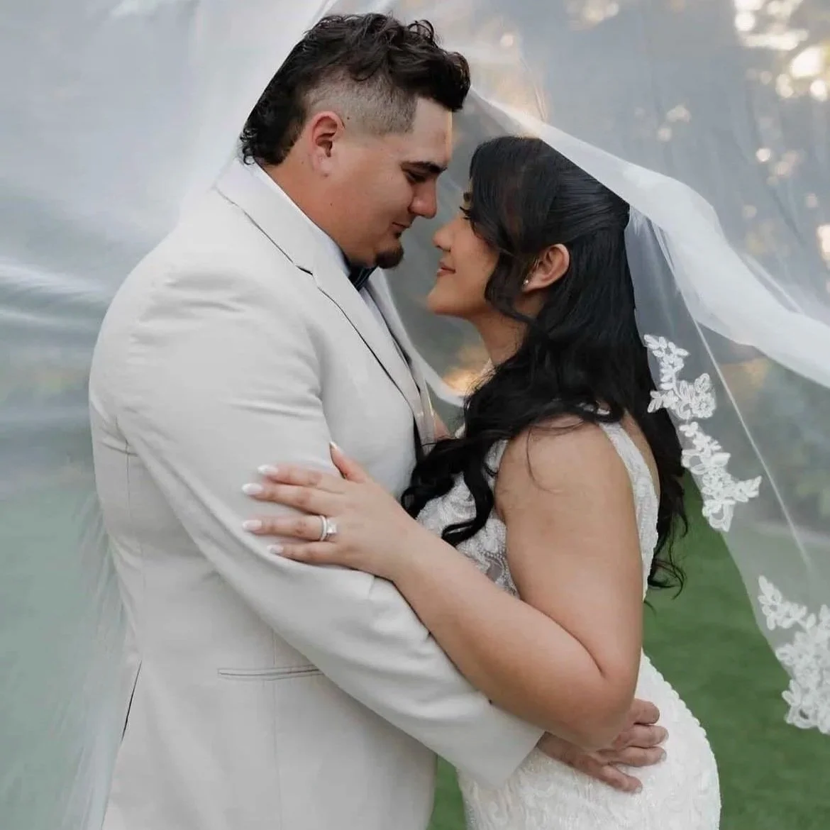 Bride with soft, cascading curls and waves by Lori Brooks Beauty - luxury on site bridal hairstylist serving Fort Lauderdale and Miami weddings.