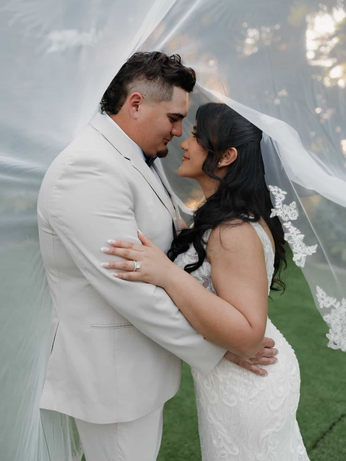Bride with soft, cascading curls and waves by Lori Brooks Beauty - luxury on site bridal hairstylist serving Fort Lauderdale and Miami weddings.