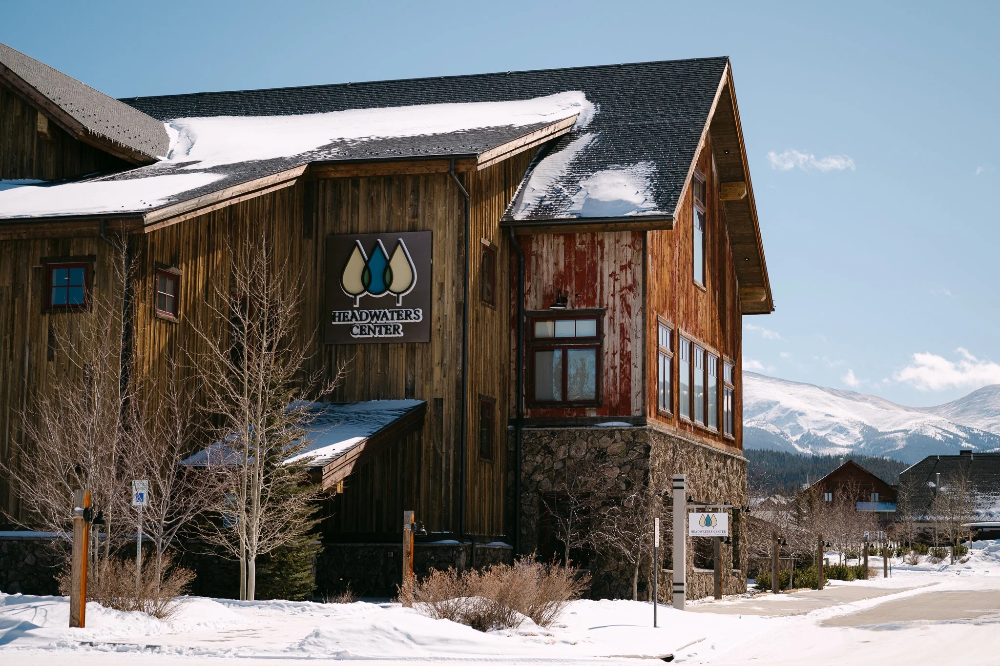 An outside view of the winter park headwaters center with snow on the ground in winter