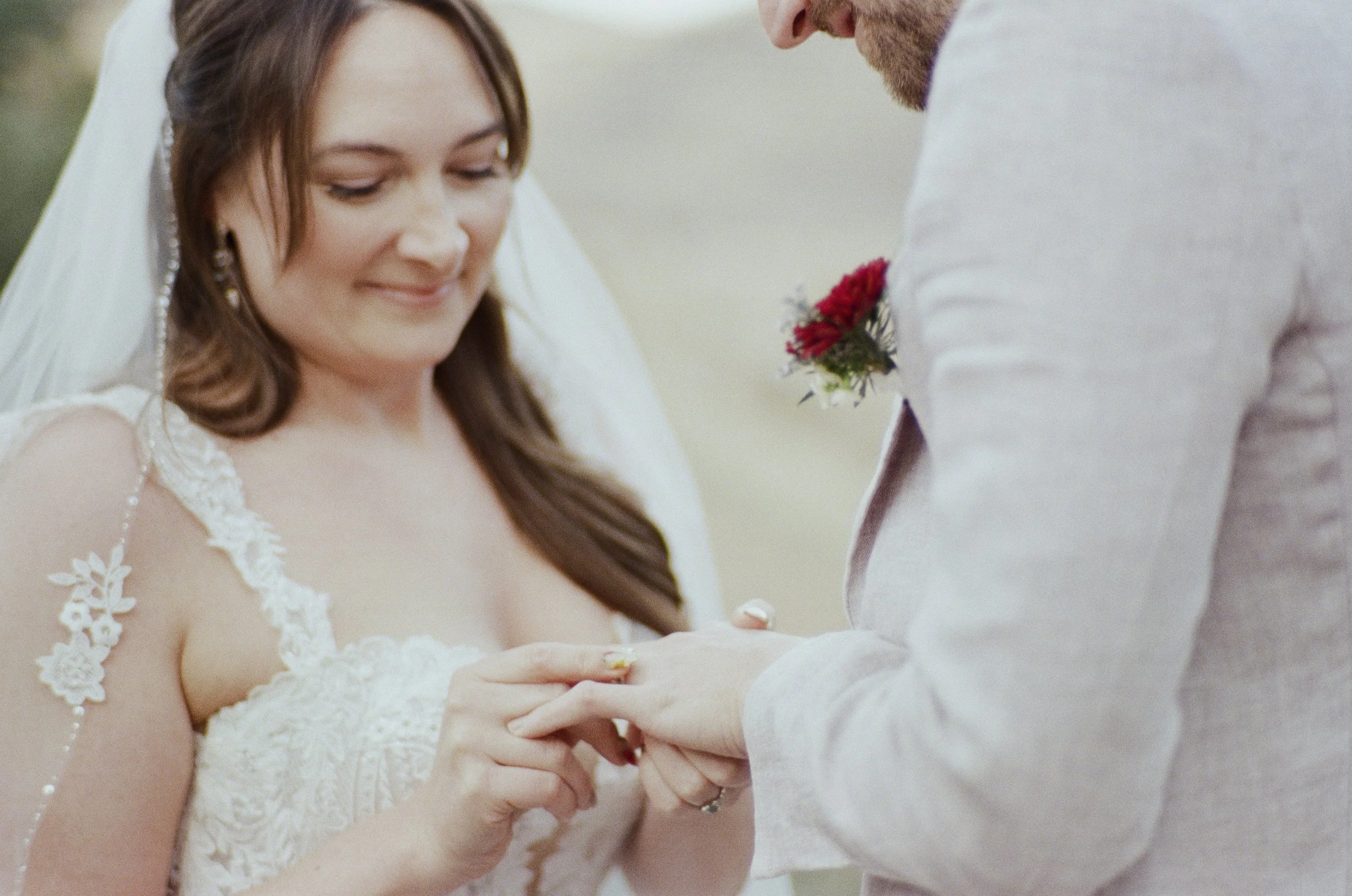 A bride and groom exchanging wedding rings during a wedding ceremony.