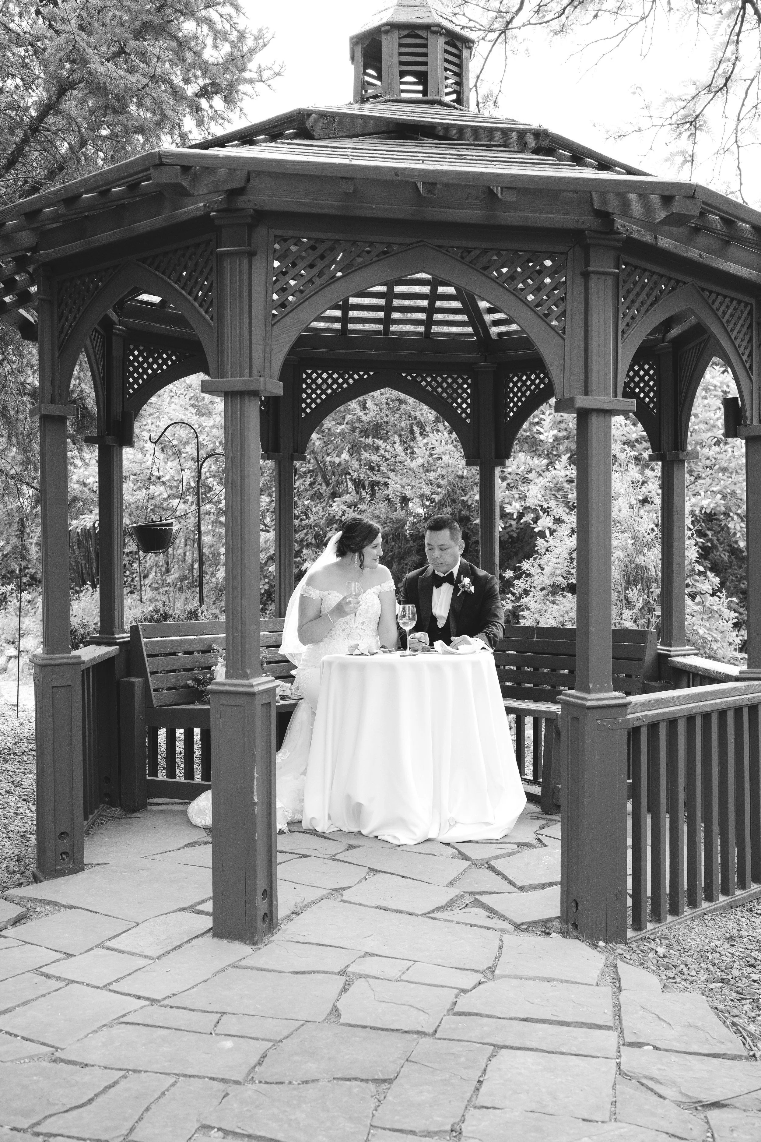 Catherine and Duncan sign their marriage license at the Church Ranch gazebo during a private moment with champagne
