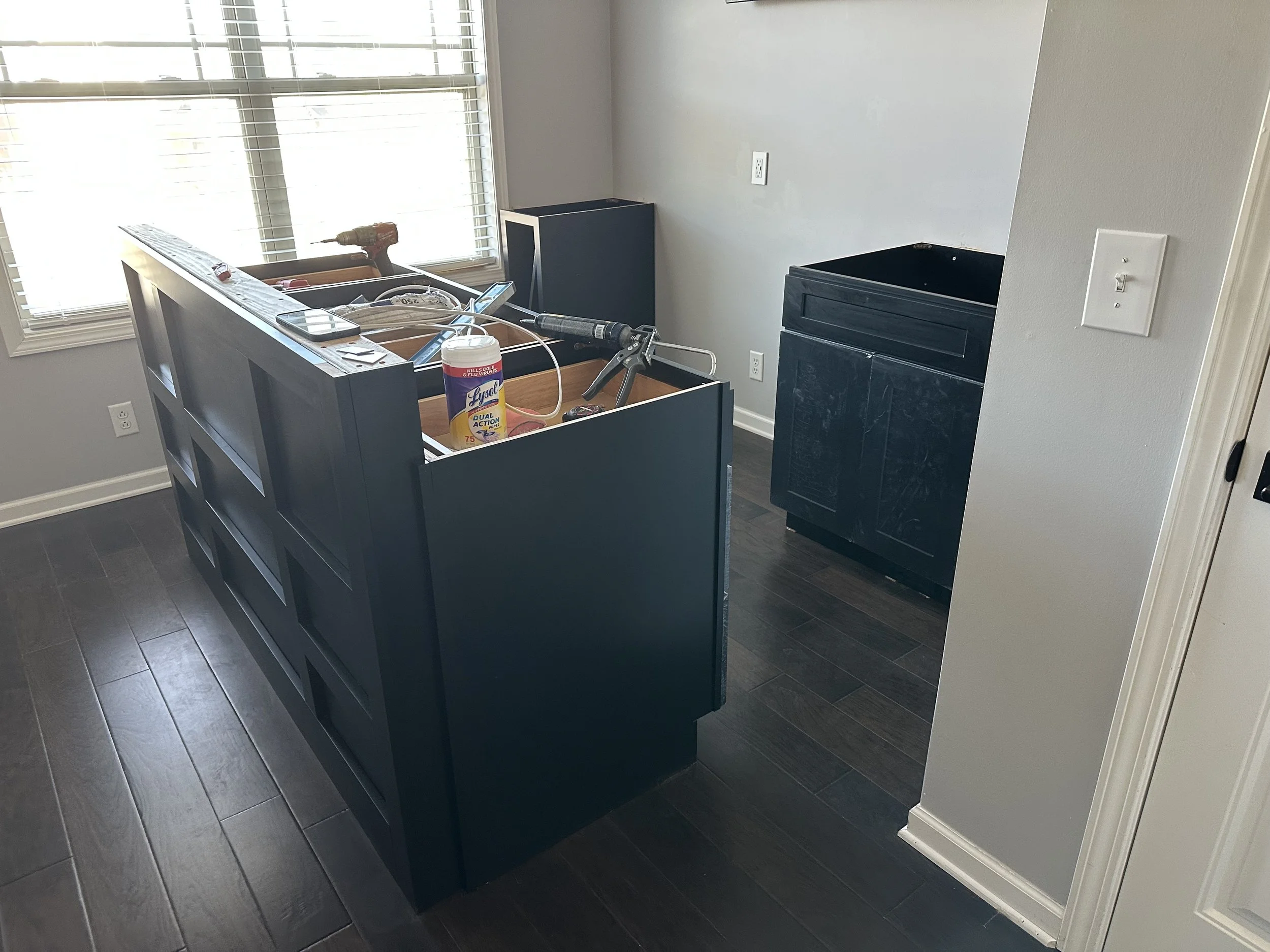 Custom kitchen cabinetry build-out during renovation, featuring premium materials and expert installation. Dangerfield Home Improvement specializes in detailed home renovations from framing to final finish.
