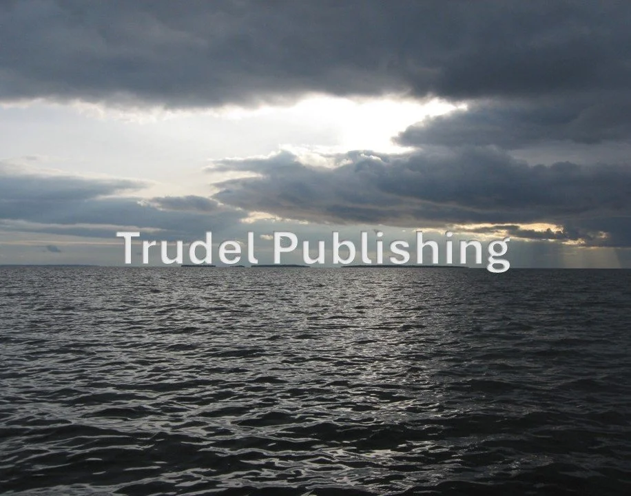 Overcast sky over a calm ocean, with the words "Trudel Publishing" overlaid on the image.