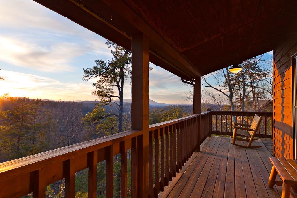 Structural lift service in the Smoky Mountains to correct a sagging balcony and stabilize failing foundation supports on a mountain cabin.