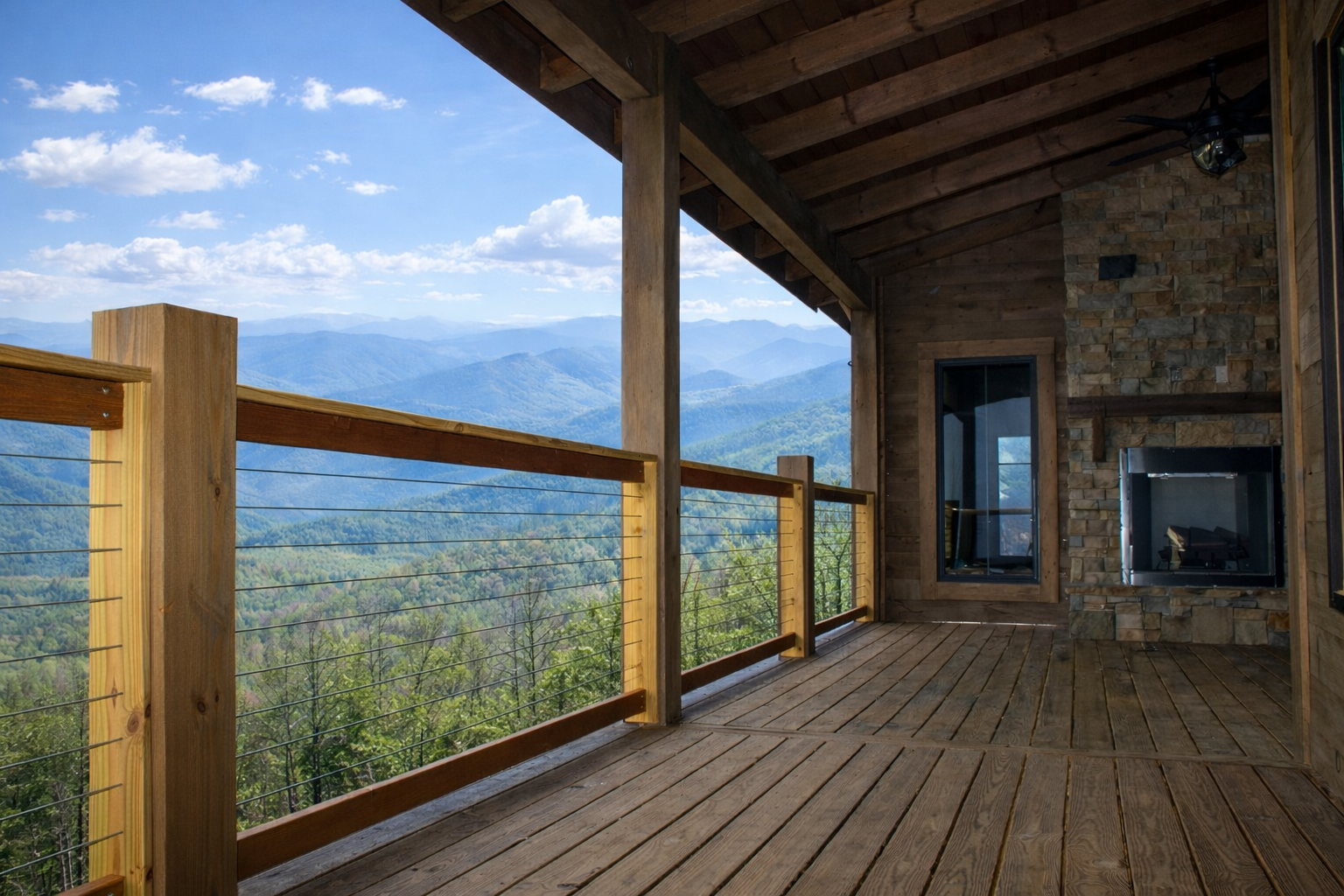 Cable railing installed on a mountain cabin deck with panoramic Smoky Mountain views.