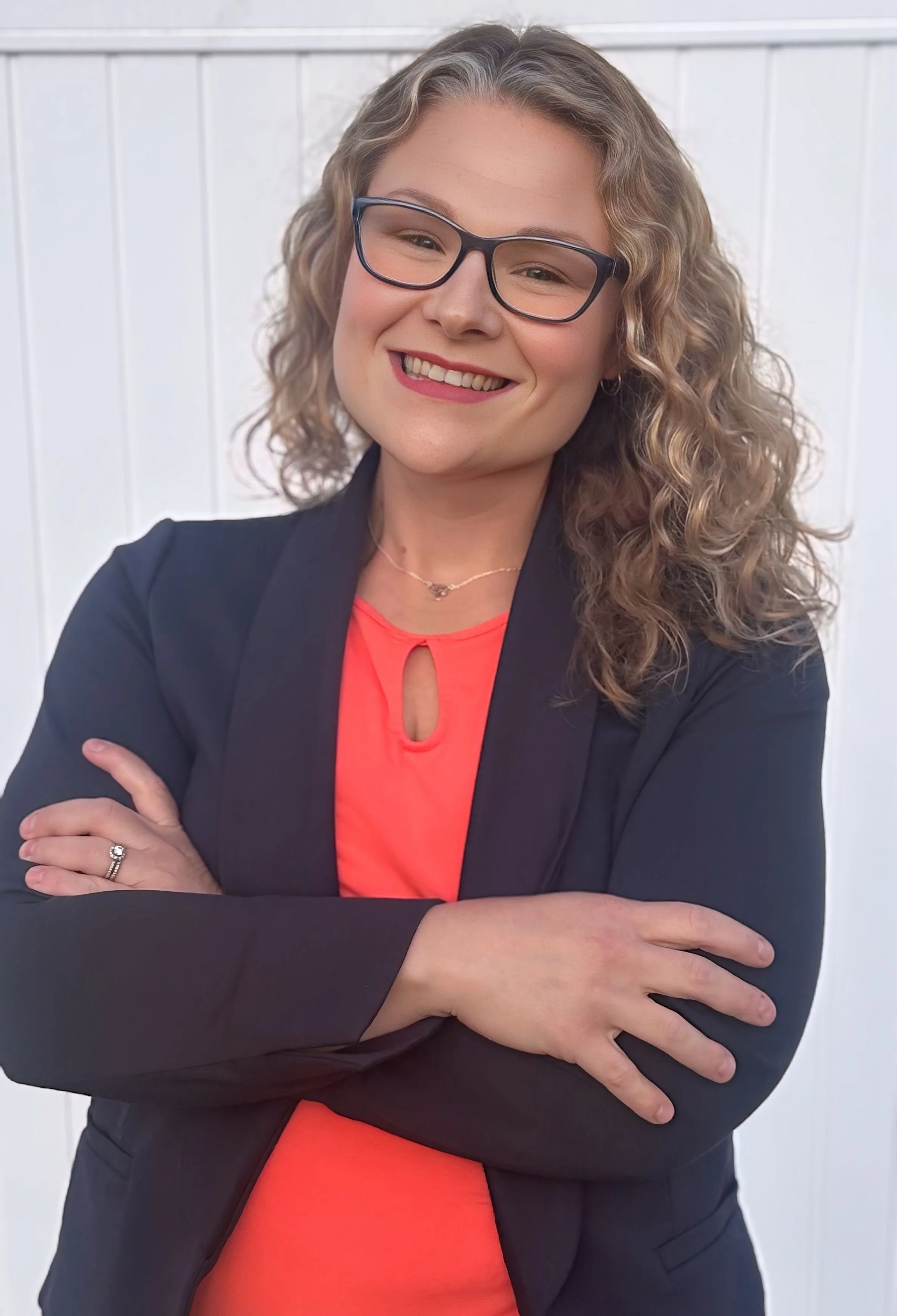 Serenity Hope Salak poses with arms crossed and a smile.