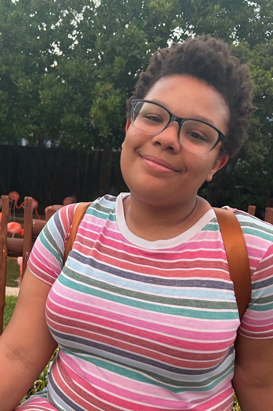 A young girl, Serenity Hope Salak's daughter, smiles for a picture