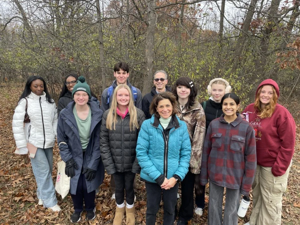 The Lloyd Scholars for Writing and the Arts Community-Engaged Writing seminar students and co-founders Scott and Julie Halpert.