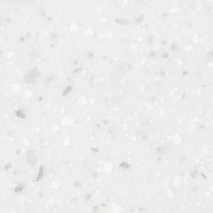 Close-up of a white, speckled Staron Pebble Swan solid surface.