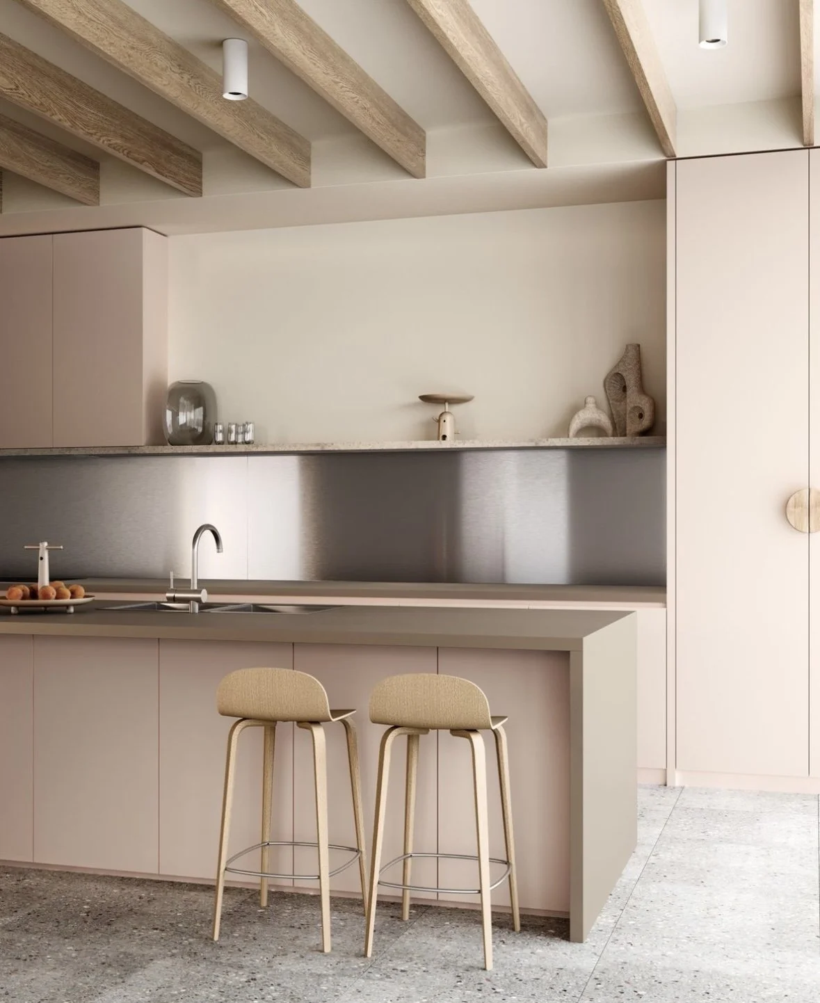 Modern kitchen with beige cabinetry, a brown laminate island with two beige barstools, stainless steel backsplash, and minimalist decor.