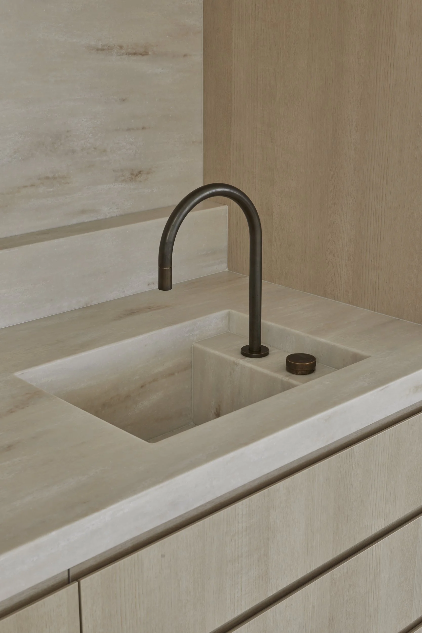 A minimalist kitchen sink with a Corian Witch Hazel benchtop and integrated sink.