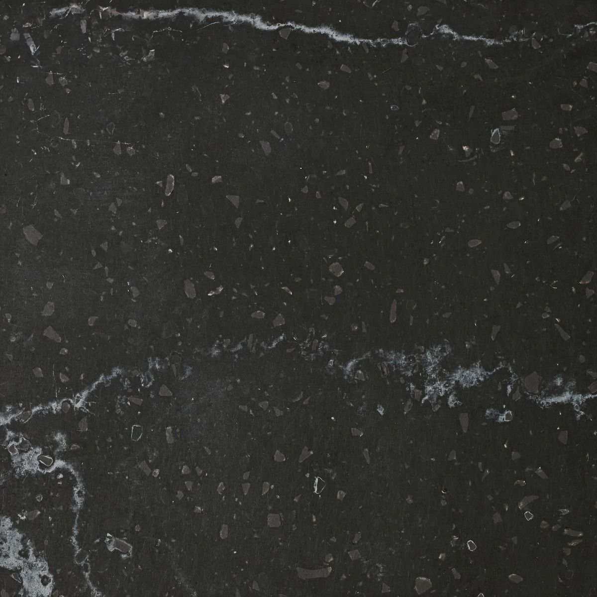 A black benchtop material with subtle white veins and irregular grey flecks. Meganite Mt Vancouver