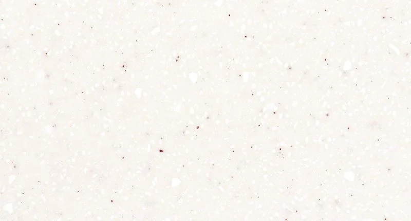A soft off-white benchtop material with white, brown and subtle black flecks. Meganite Polar Mist.