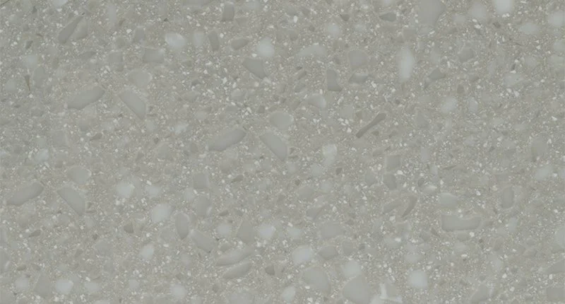 A grey based benchtop material with light grey specks. Meganite Winter Boulder.
